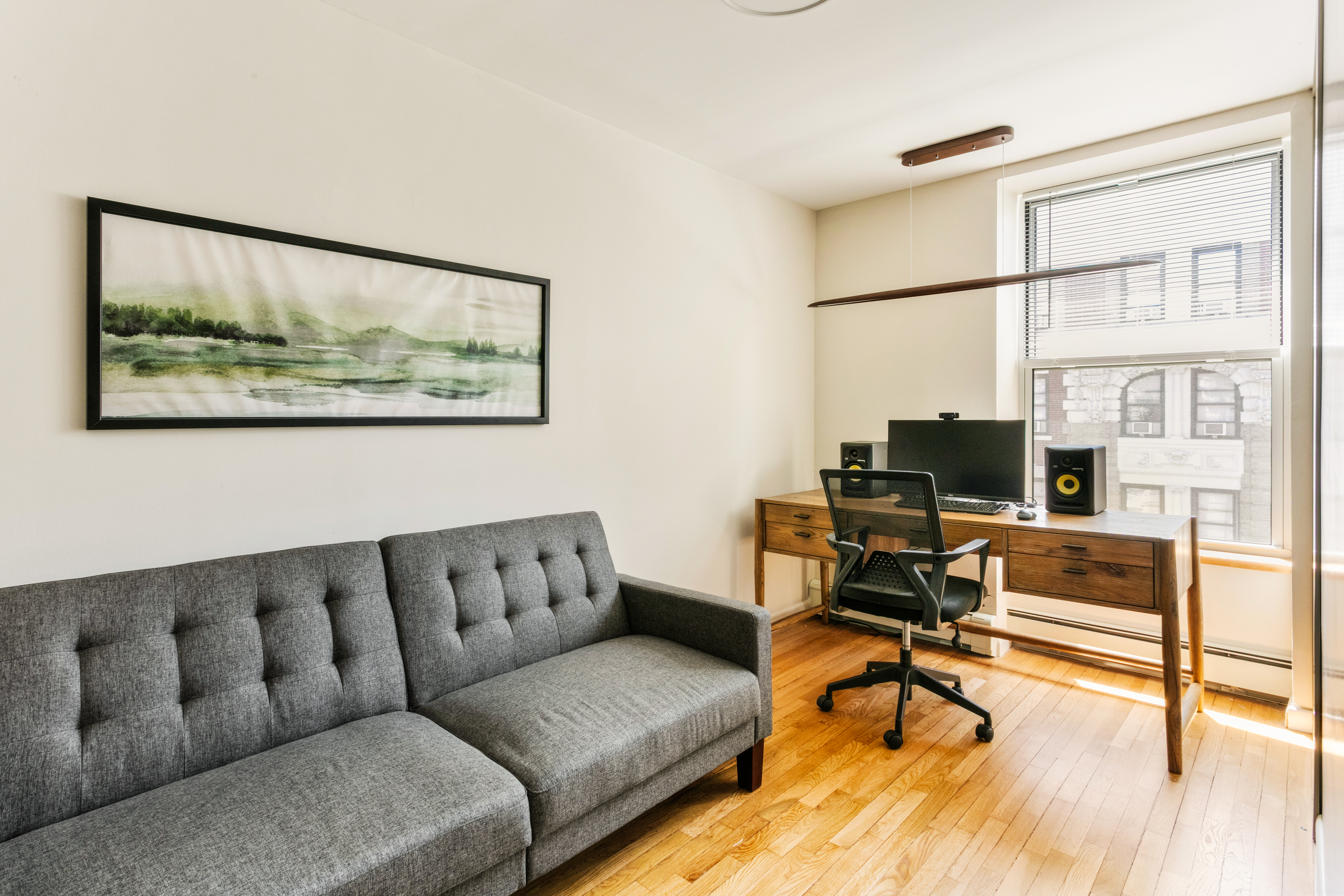 317 West 95th Street, Unit 6F Manhattan, NY 10025 - Photo 9 of 11 a living room with furniture and a flat screen tv with wooden floor