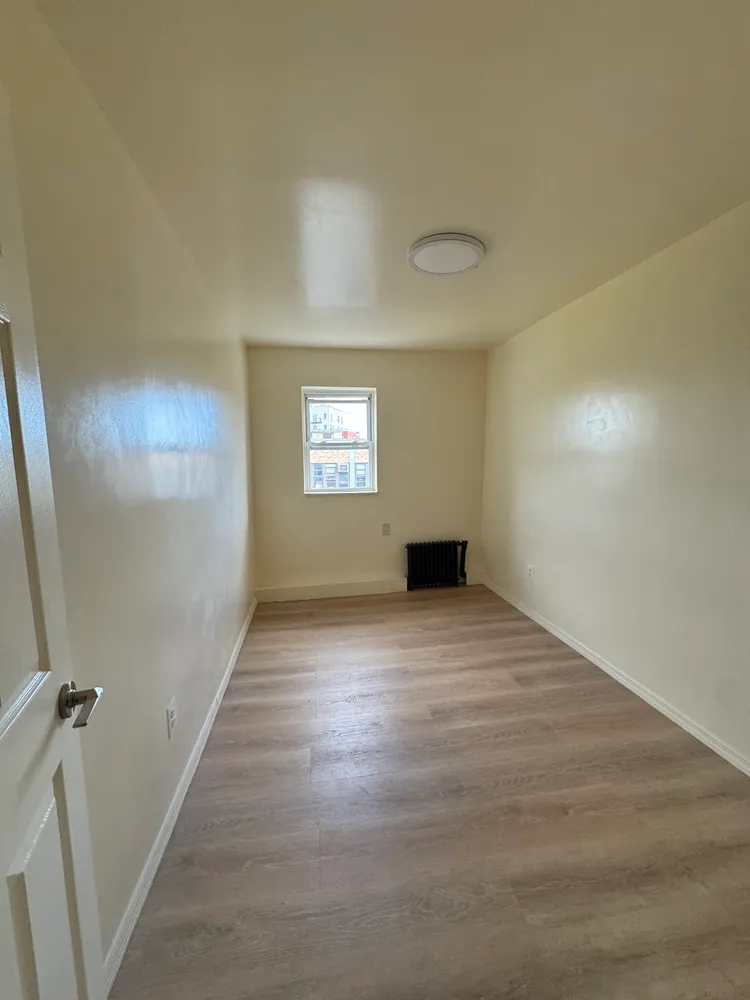 a view of an empty room and window