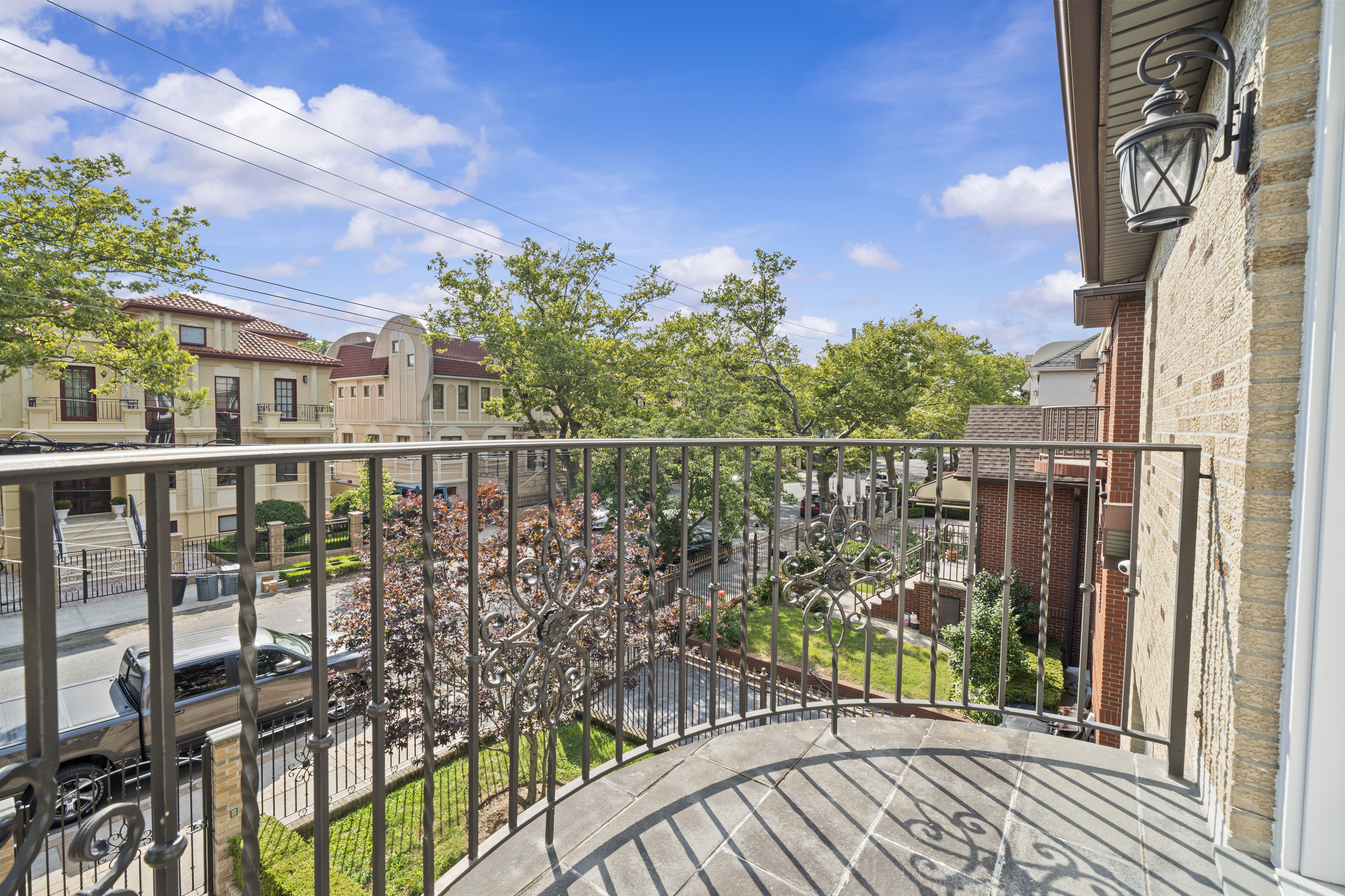 2253 East 64th Street Brooklyn, NY 11234 - Photo 21 of 45 a view of a balcony with wooden floor