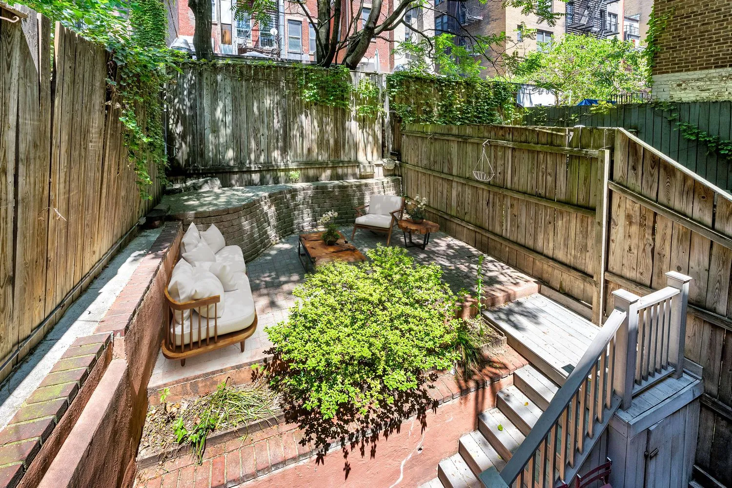 a view of a backyard with sitting area