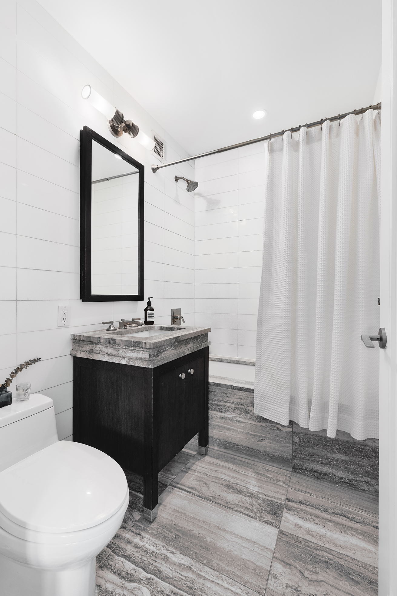 80 Riverside Boulevard, Unit 12D Manhattan, NY 10069 - Photo 9 of 16 a bathroom with a sink and a mirror