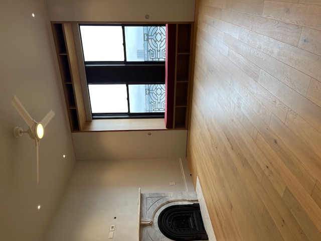 265 Riverside Drive, Unit 11F Manhattan, NY 10025 - Photo 8 of 18 an empty room with wooden floor and a large window