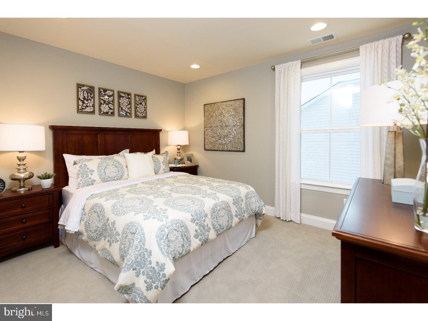 407 Quarry Point Road Malvern, PA 19355 - Photo 12 of 14 a bedroom with a bed and a window