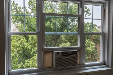 a view of a wooden door and a window