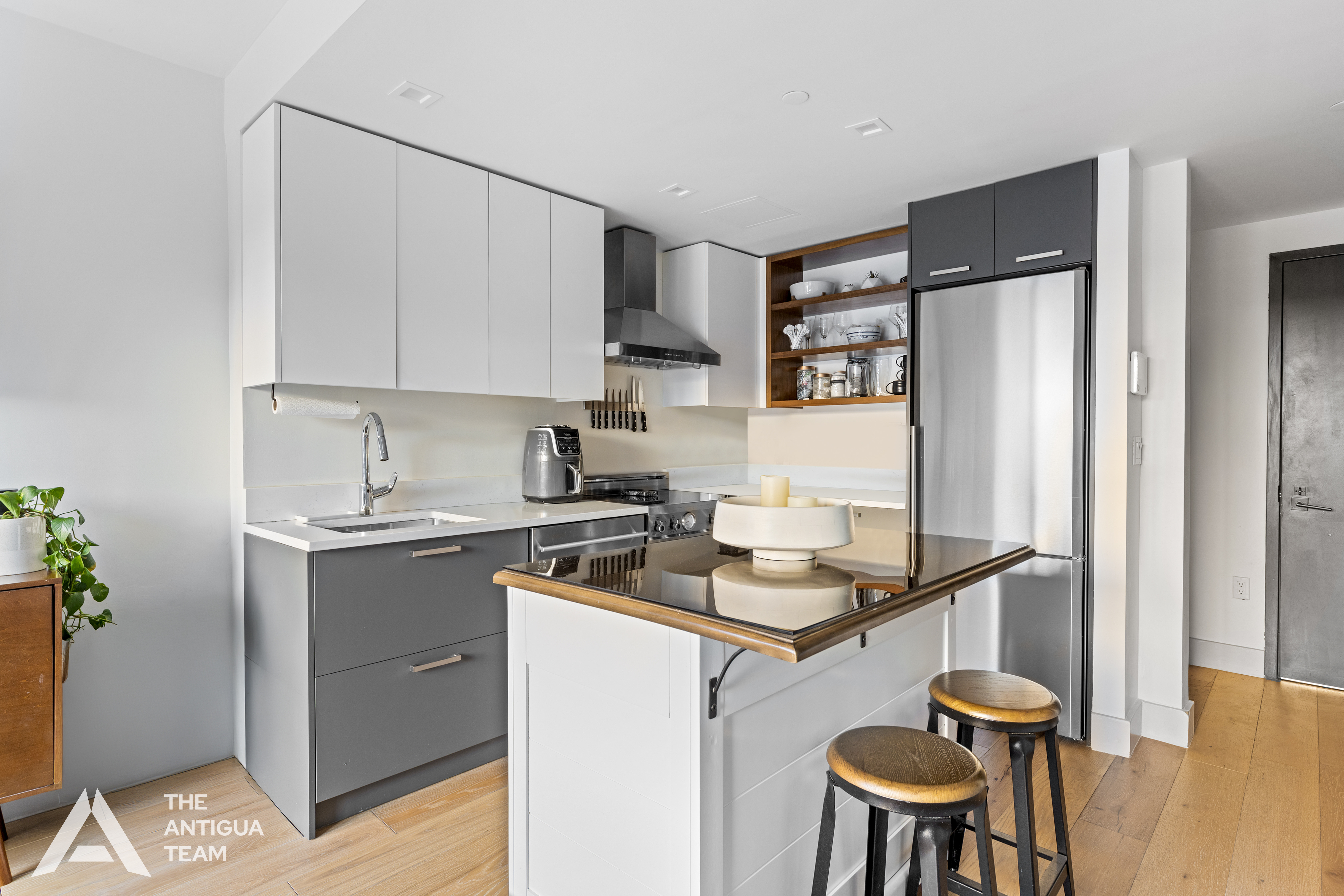 167 Eagle Street, Unit 1B Brooklyn, NY 11222 - Photo 3 of 13 a kitchen with stainless steel appliances granite countertop a stove refrigerator sink and cabinets