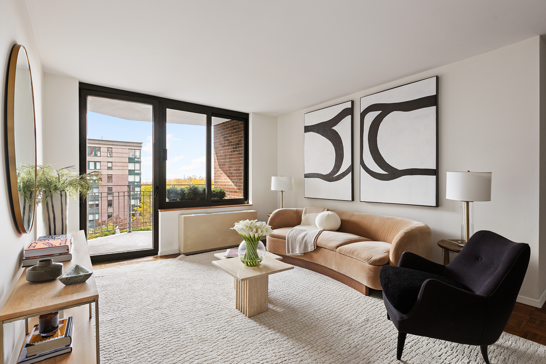 2 South End Avenue, Unit 7B Manhattan, NY 10280 - Photo 1 of 17 a living room with furniture and a floor to ceiling window