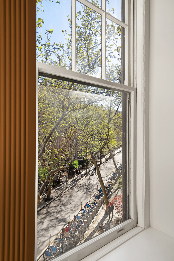 67 Perry Street, Unit 3 Manhattan, NY 10014 - Photo 20 of 22 a view of a room with a window and a porch