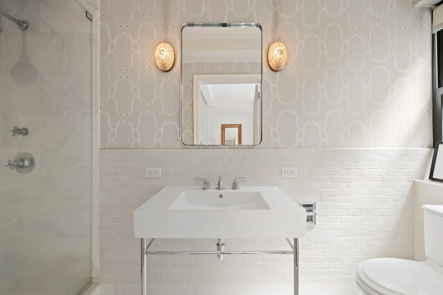 a bathroom with a toilet and a sink