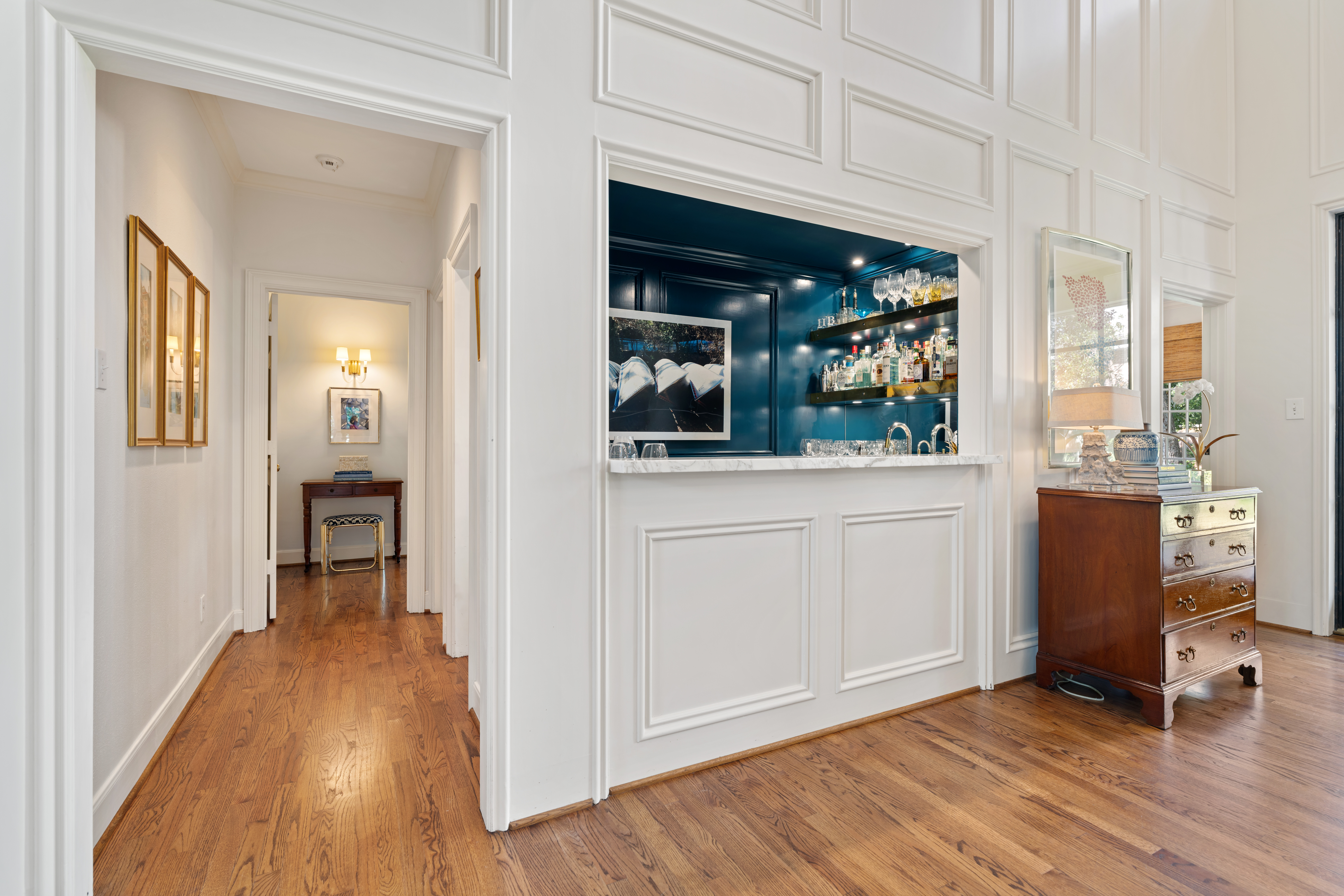 711 Pifer Road Houston, TX 77024 - Photo 16 of 53 a view of a hallway and wooden floor with windows
