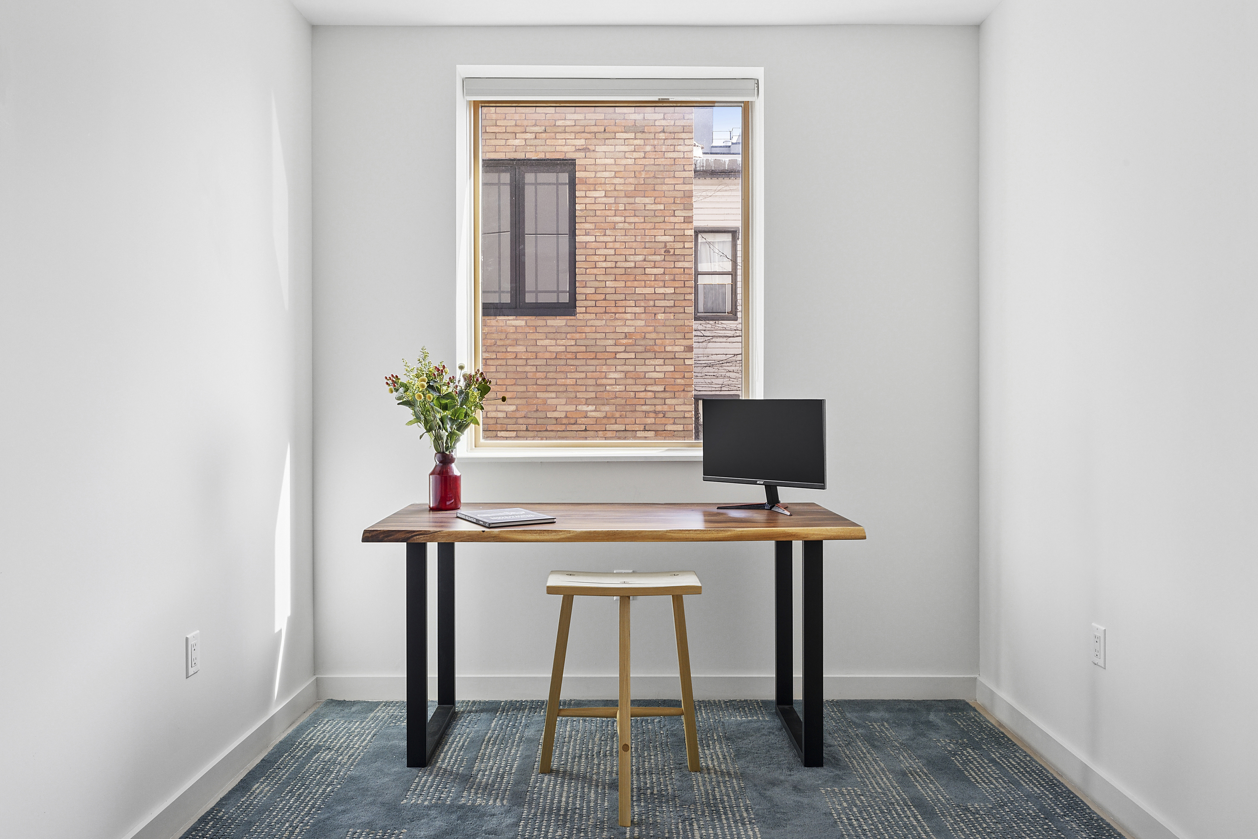 156 Devoe Street, Unit 3F Brooklyn, NY 11211 - Photo 6 of 9 a view of a workspace with furniture