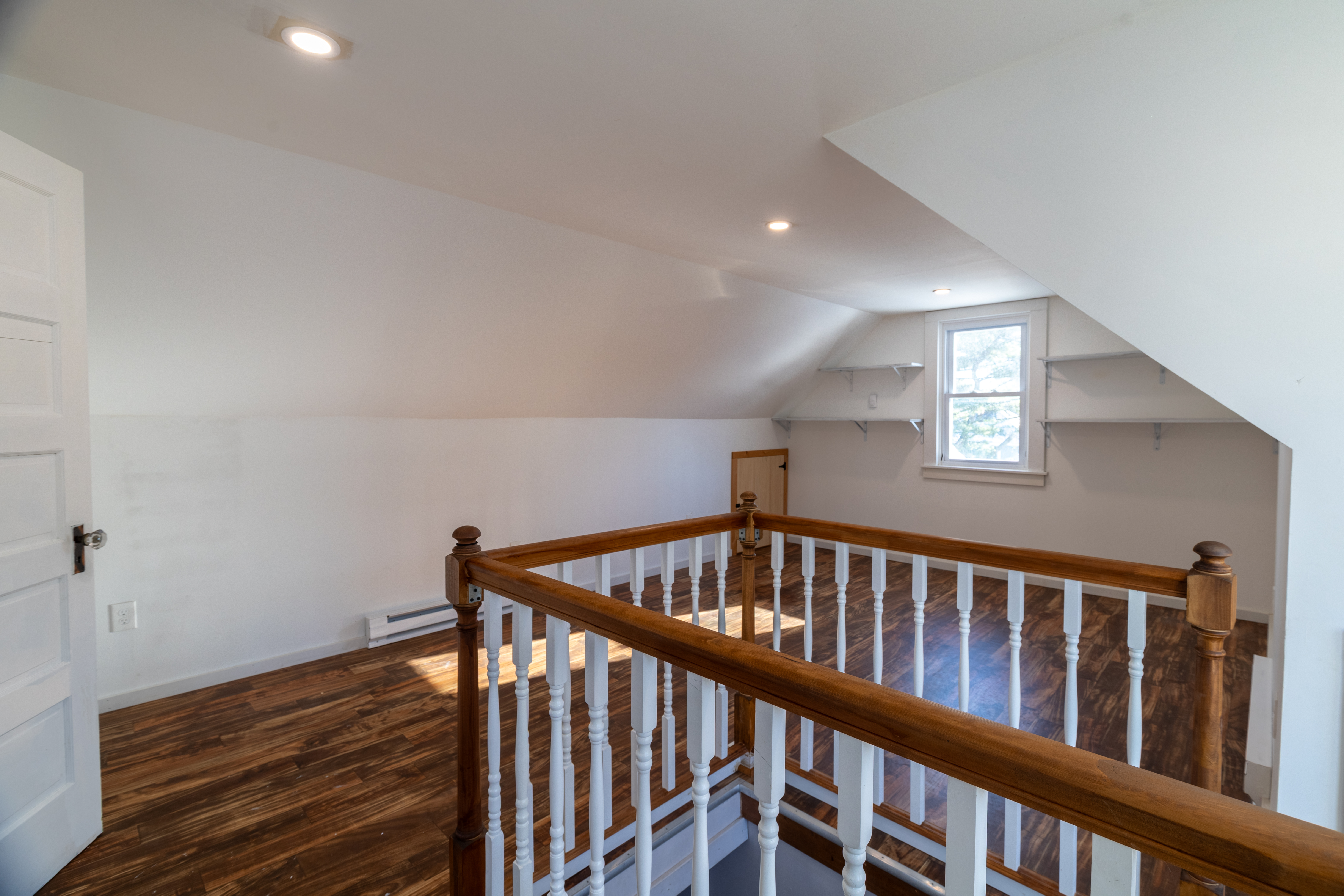 90 School Street New London, CT 06320 - Photo 26 of 34 a view of staircase with railing and white walls