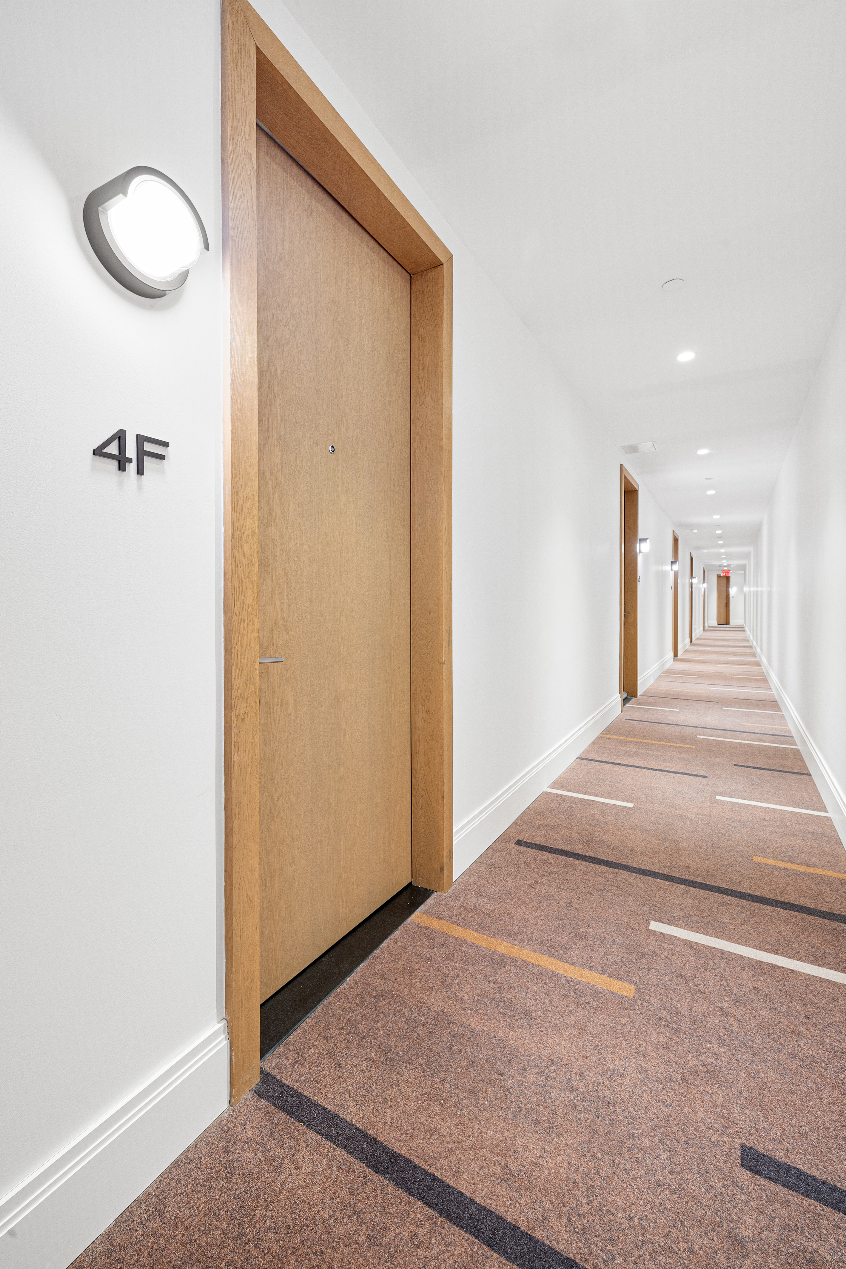 300 West 122nd Street, Unit 4F Manhattan, NY 10027 - Photo 16 of 32 a bedroom with a bed and a chandelier