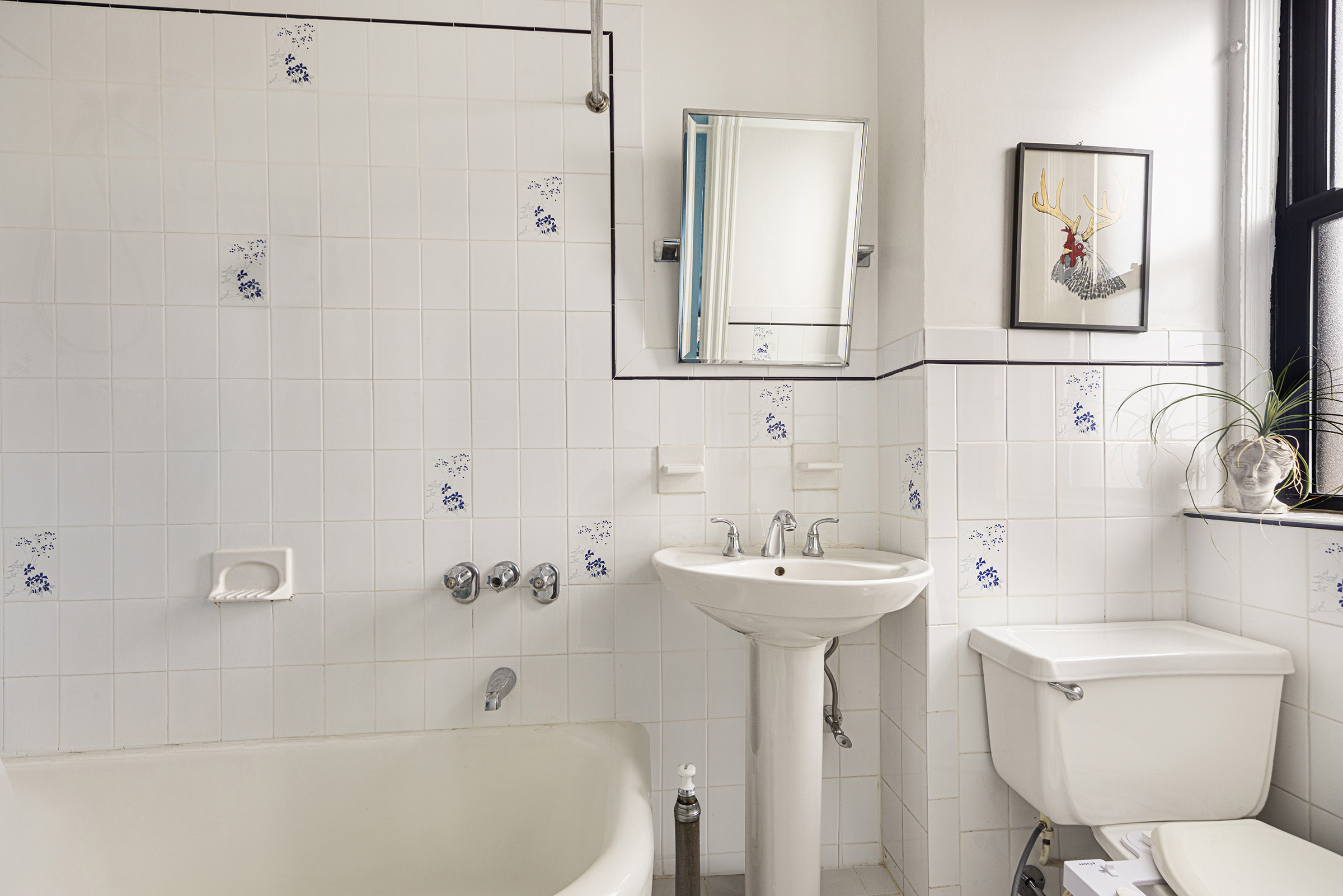 710 West End Avenue, Unit 9A Manhattan, NY 10025 - Photo 5 of 8 a bathroom with a sink a toilet and shower