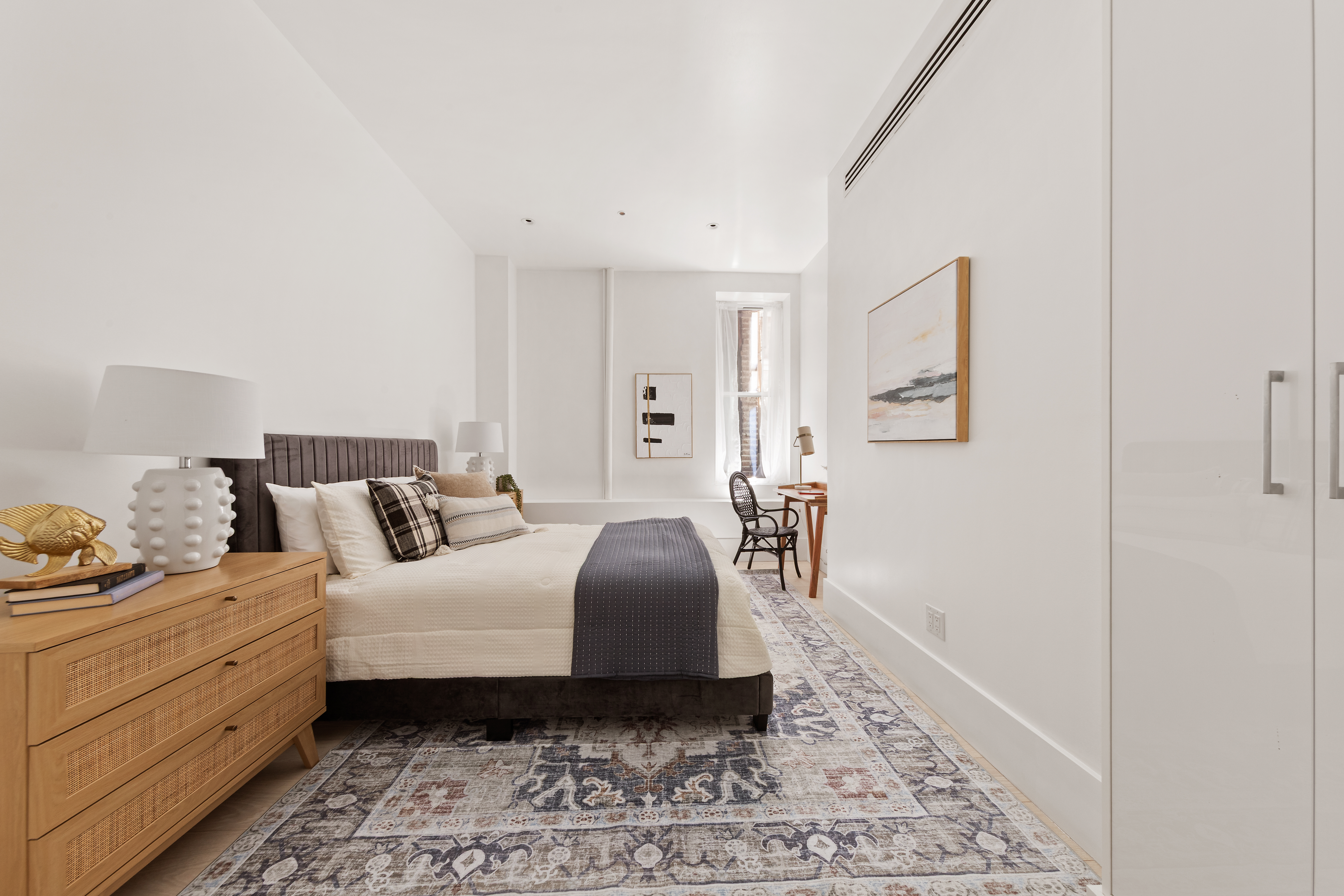48 West 22nd Street, Unit 2 Manhattan, NY 10010 - Photo 9 of 11 a bedroom with a bed and wooden floor