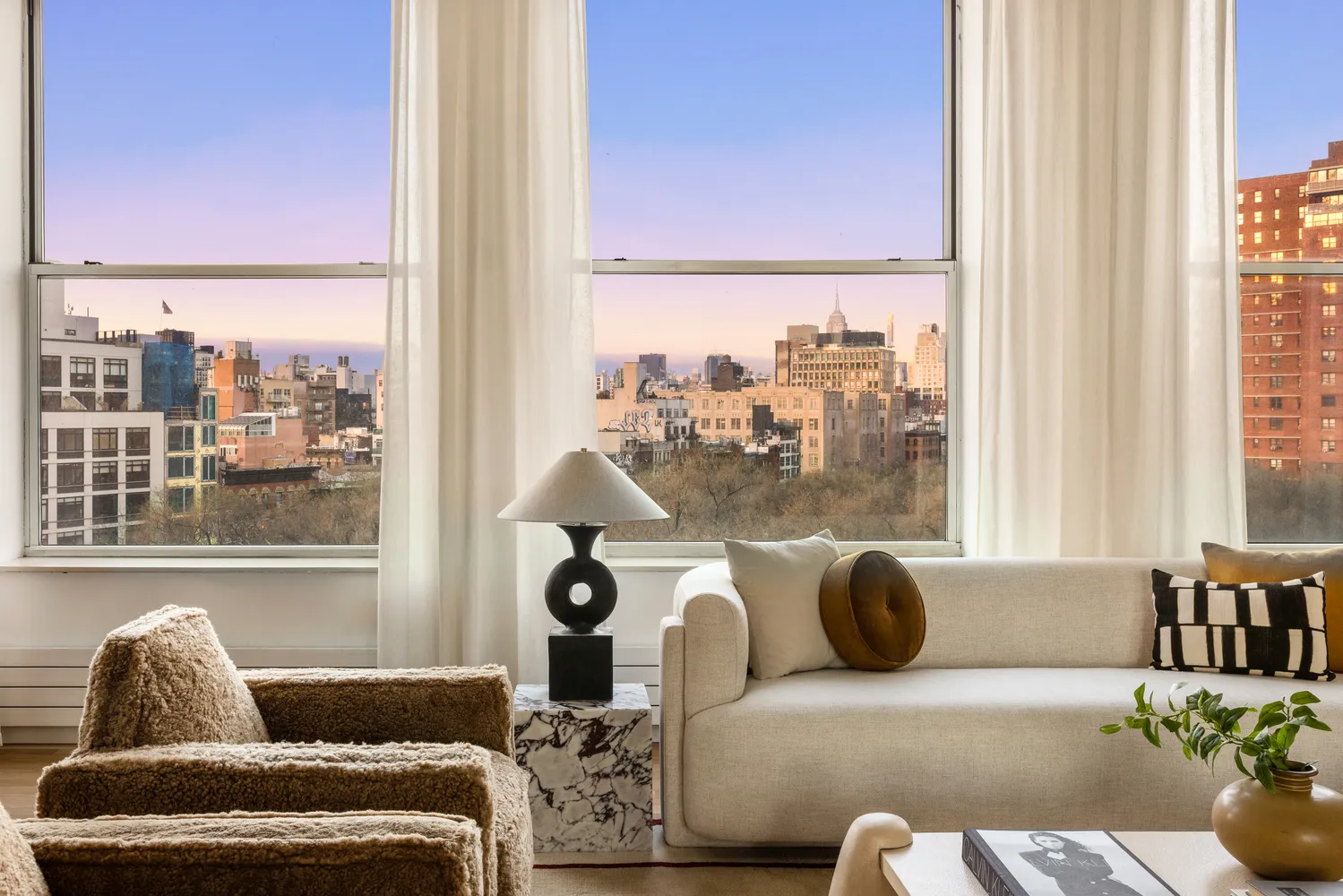 a living room with furniture and a window