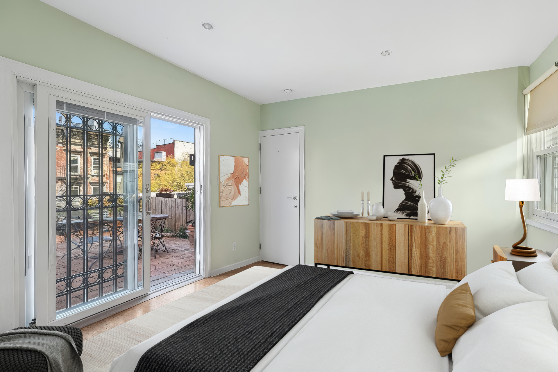 220 East 5th Street, Unit PHE Manhattan, NY 10003 - Photo 6 of 11 a bedroom with a bed and wooden floor