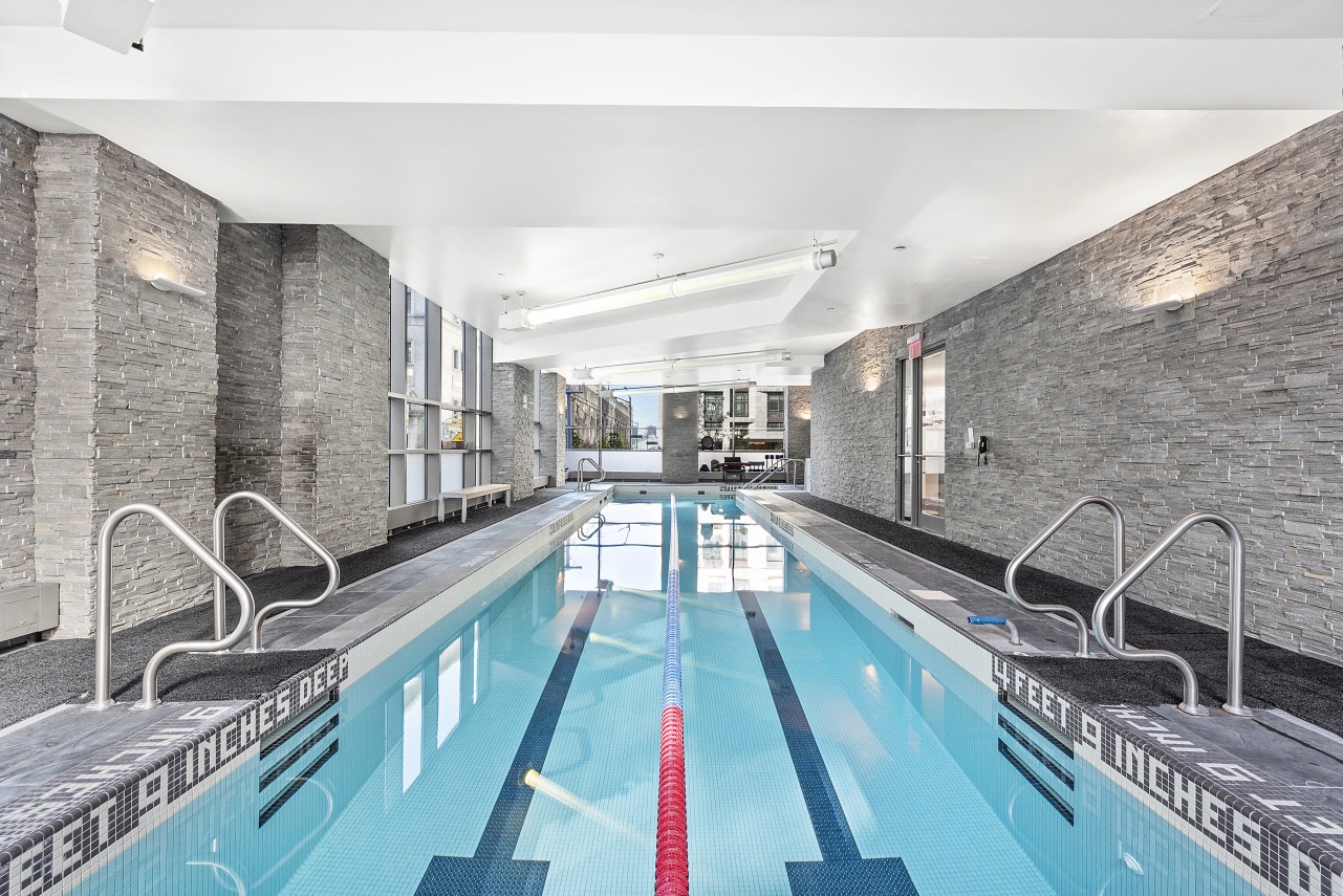 10 West End Avenue, Unit 7C Manhattan, NY 10023 - Photo 5 of 9 a large white kitchen with a large window