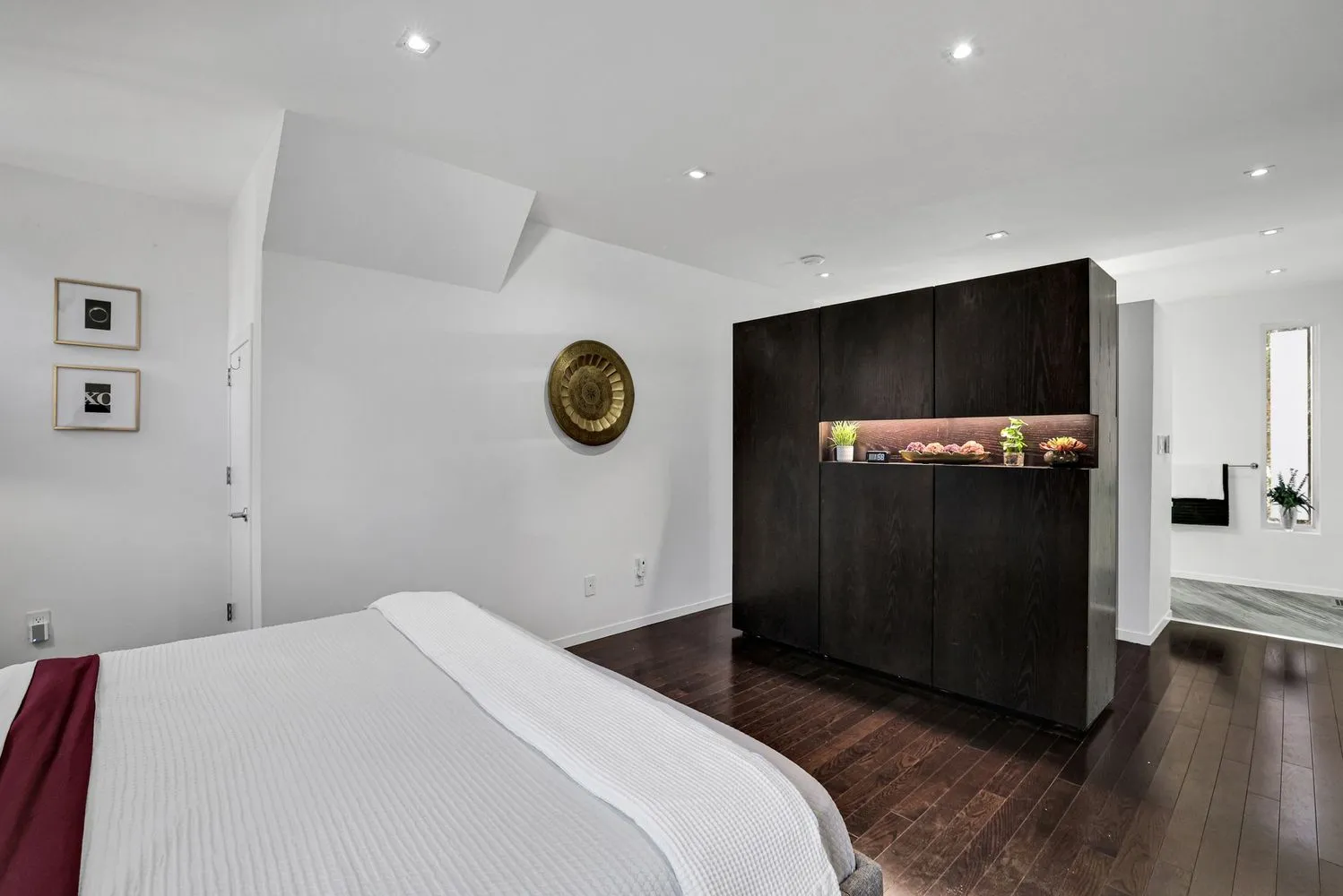 a bedroom with a bed and a television