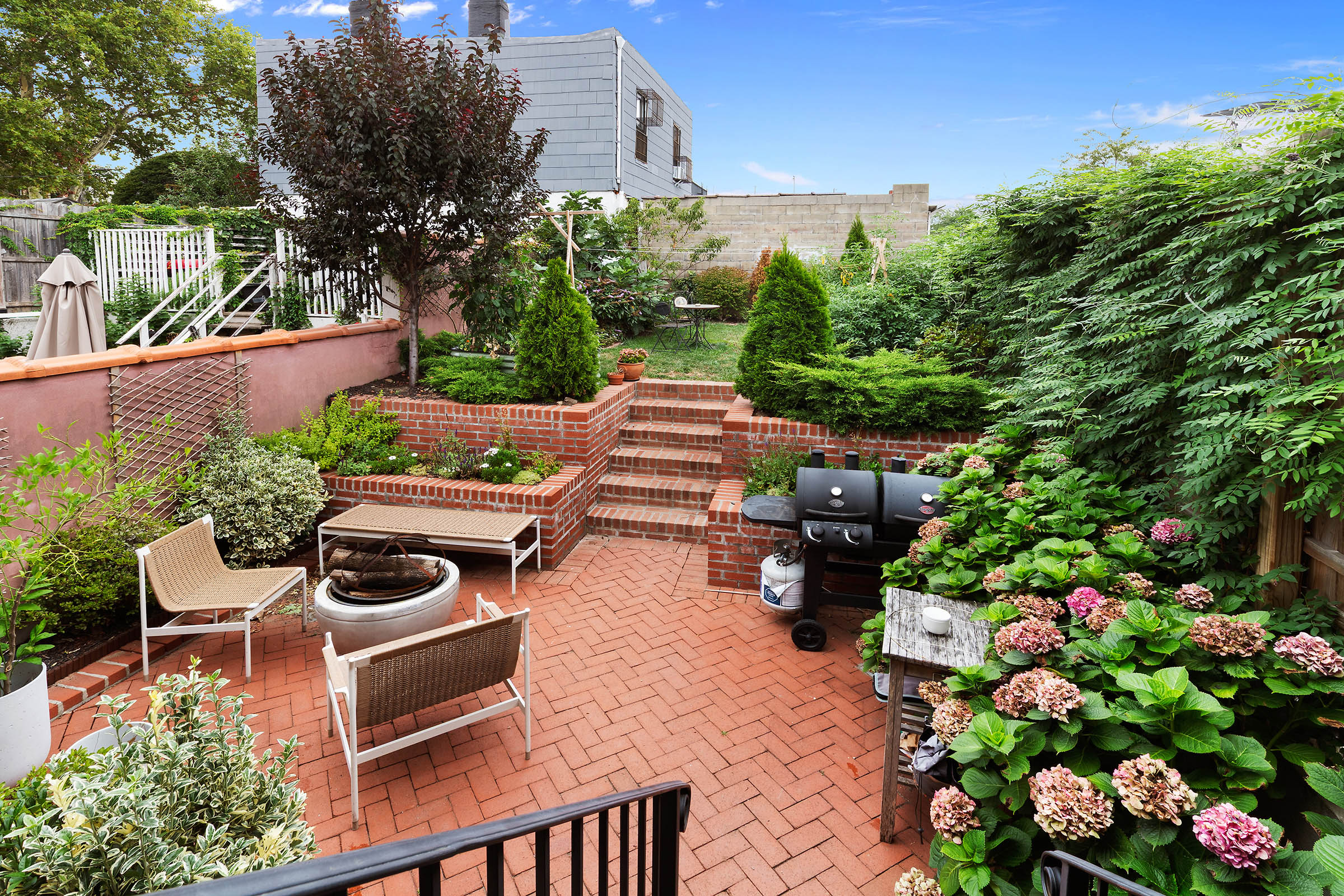 209 Onderdonk Avenue Queens, NY 11385 - Photo 8 of 16 a backyard of a house with lots of green space