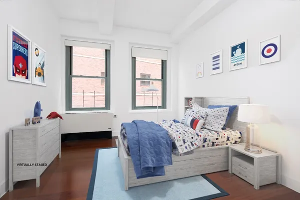 a bed room with bed and a window