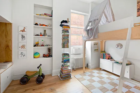 a room with furniture and a wooden floor