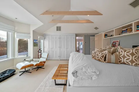 a bedroom with a bed and dresser