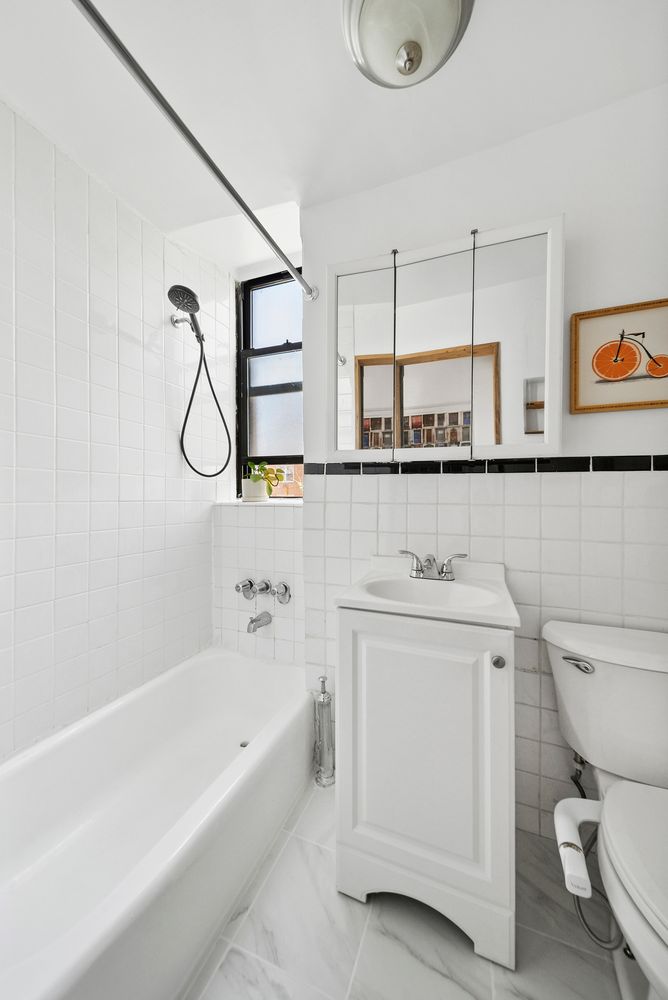 a bathroom with a sink a toilet and a bathtub