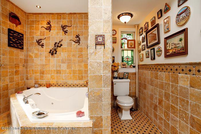 630 East 24th Street Brooklyn, NY 11210 - Photo 17 of 28 a bathroom with a toilet and a shower