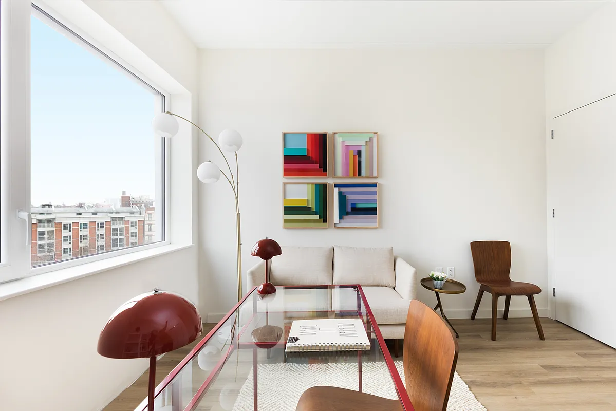 8 Palmetto Street, Unit 713 Brooklyn, NY 11221 - Photo 6 of 23 a living room with furniture and a chair