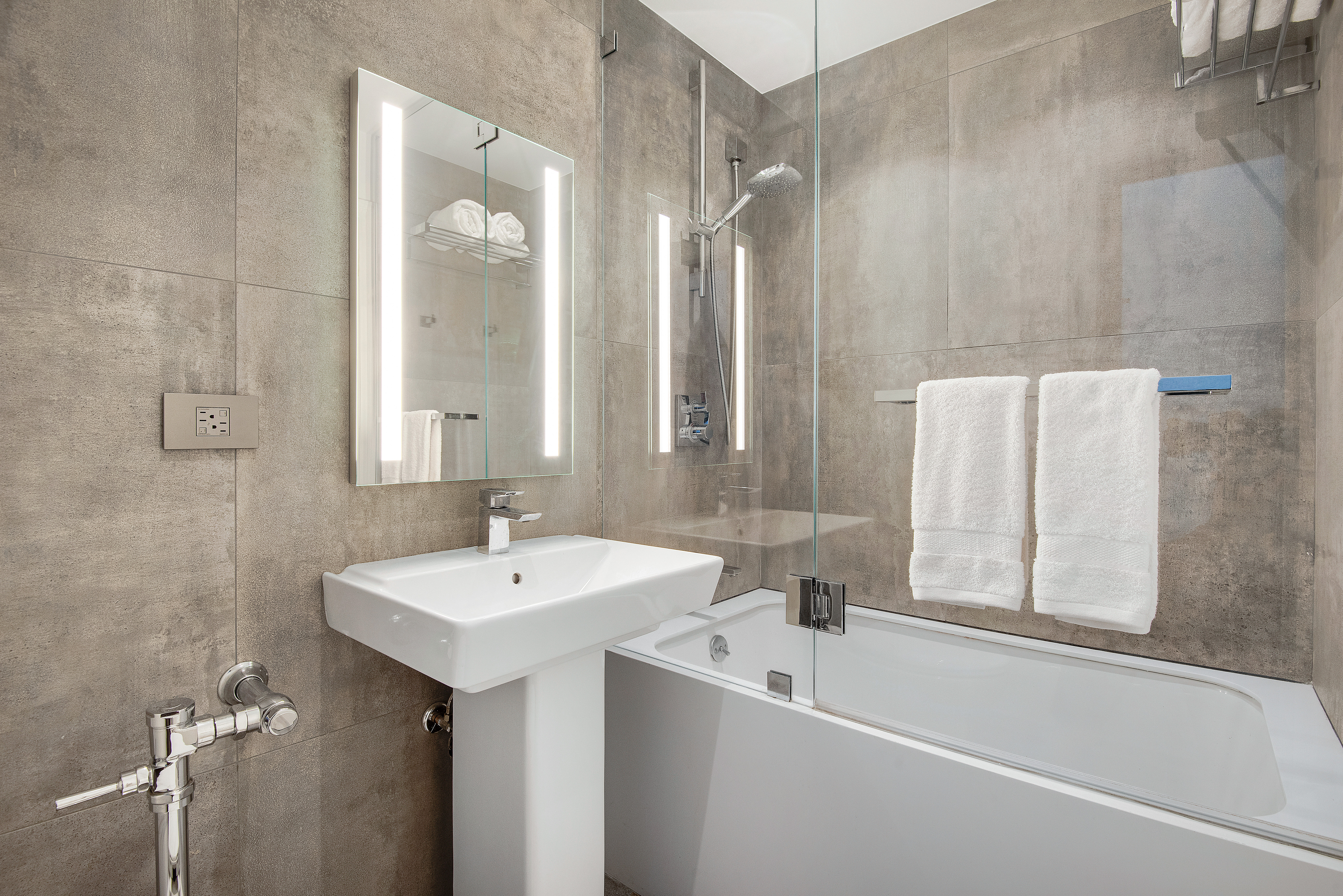 439 East 51st Street, Unit 8A Manhattan, NY 10022 - Photo 12 of 13 a bathroom with a sink and a bathtub