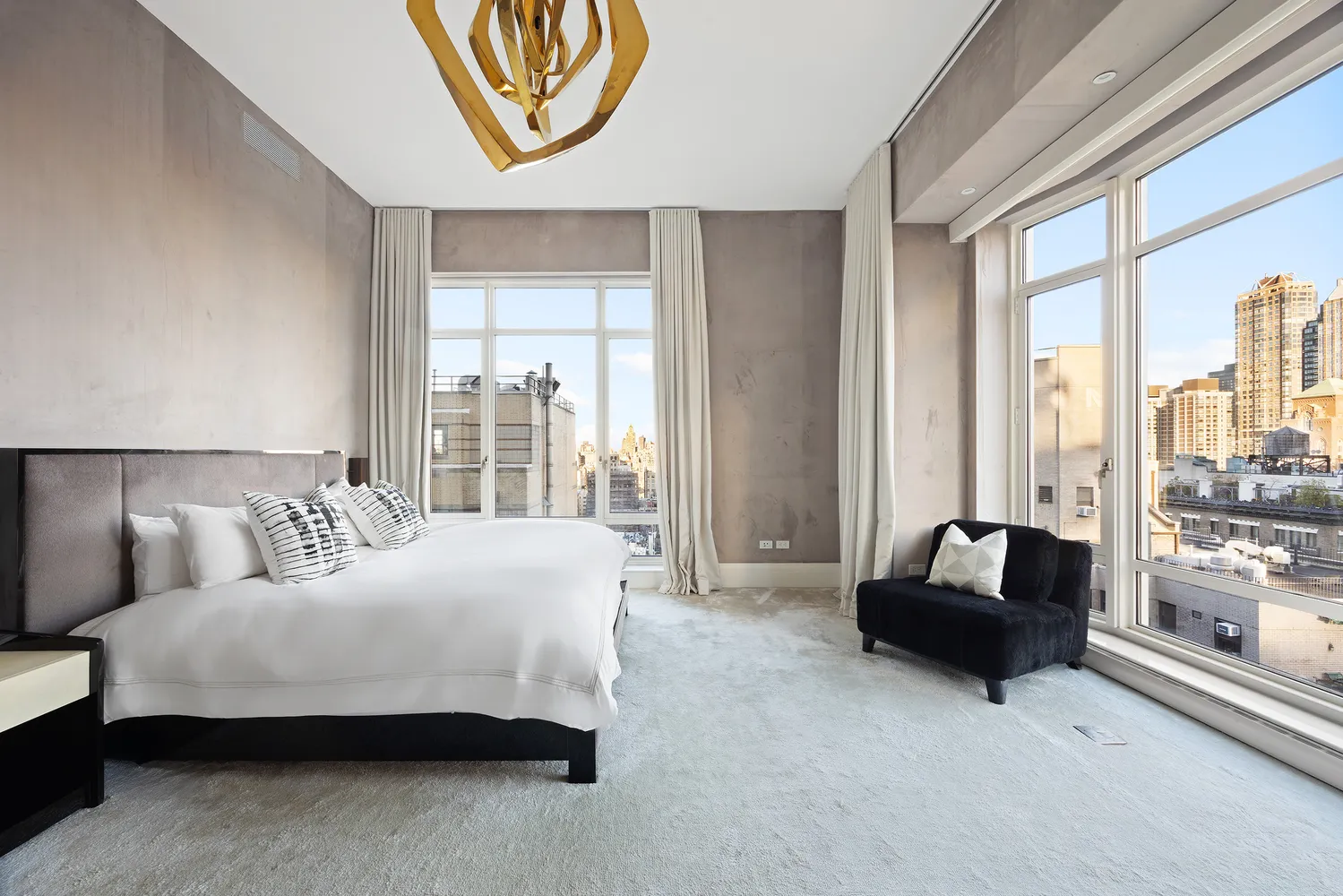 a bedroom with a bed and a couch