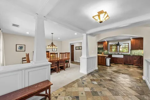 a living room with furniture and a rug
