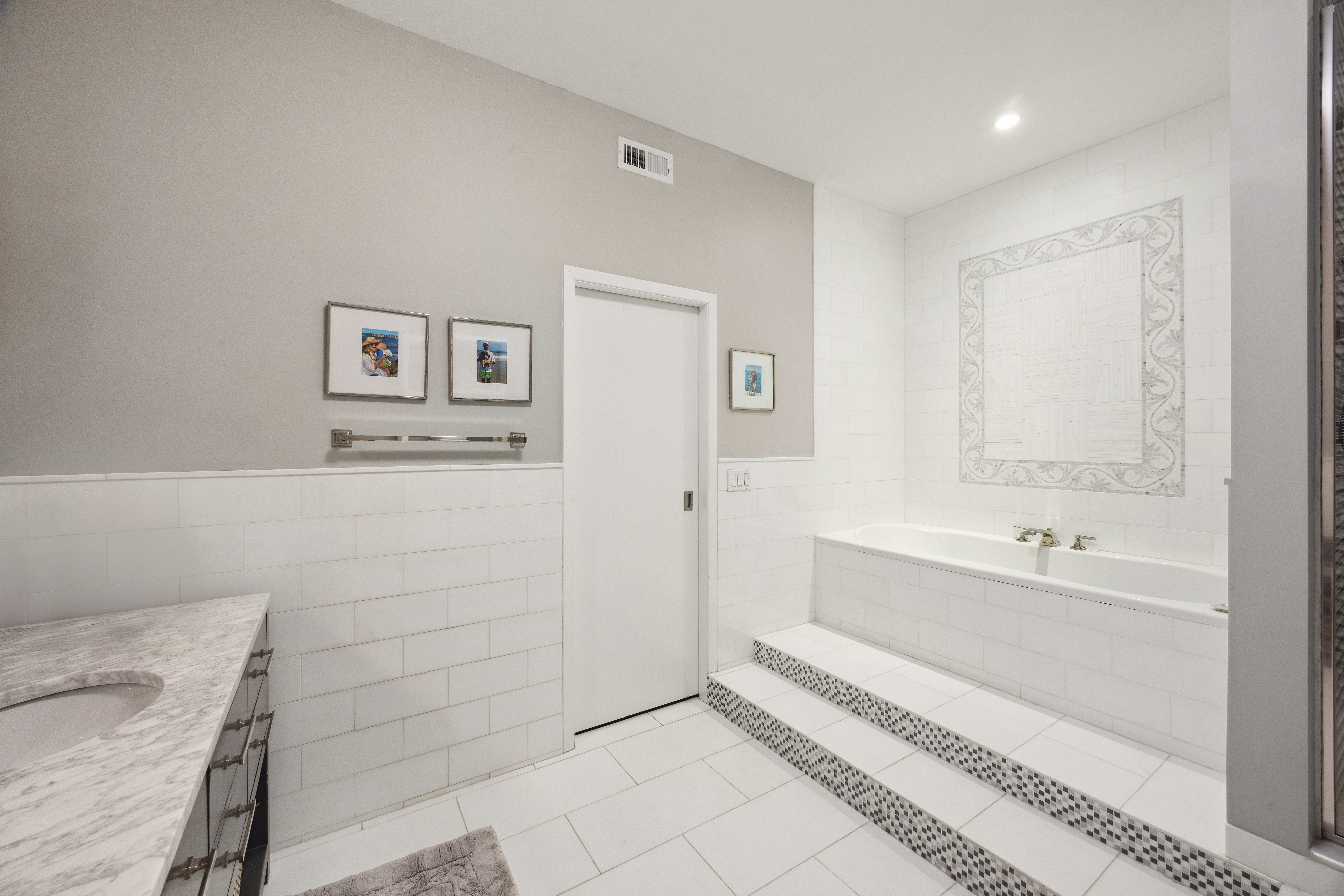 129 West 22nd Street, Unit 5A Manhattan, NY 10011 - Photo 11 of 13 a bathroom with a bathtub and a sink