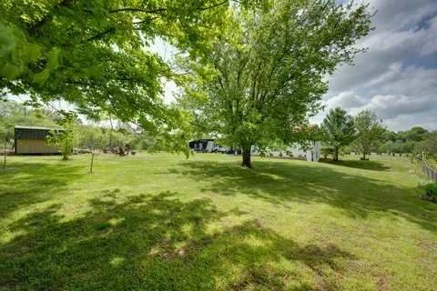 a view of a golf course with a big yard