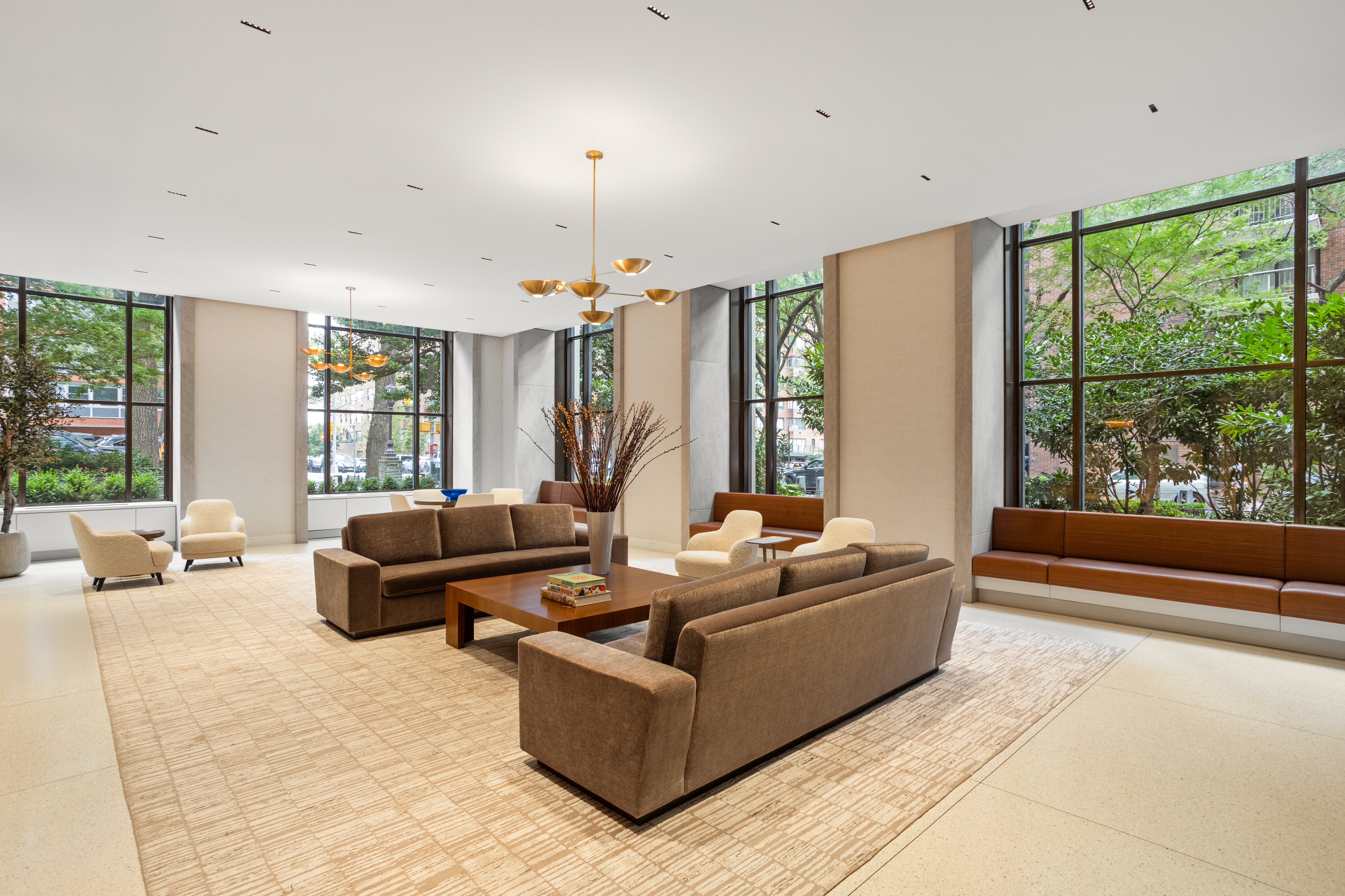 60 East End Avenue, Unit 12C Manhattan, NY 10028 - Photo 25 of 27 a living room with furniture and large windows