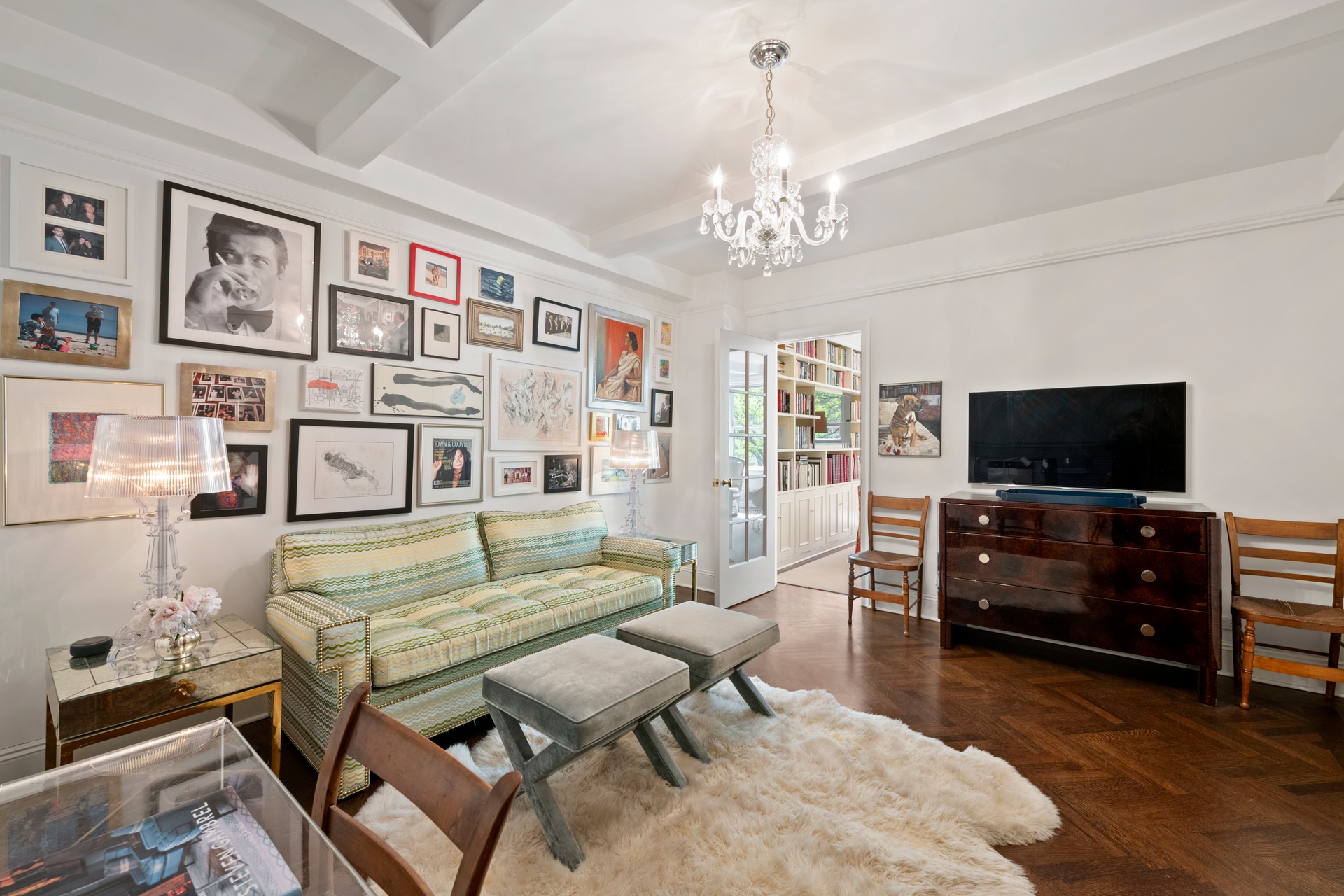 225 East 79th Street, Unit 3A Manhattan, NY 10075 - Photo 7 of 10 a living room with furniture and a flat screen tv