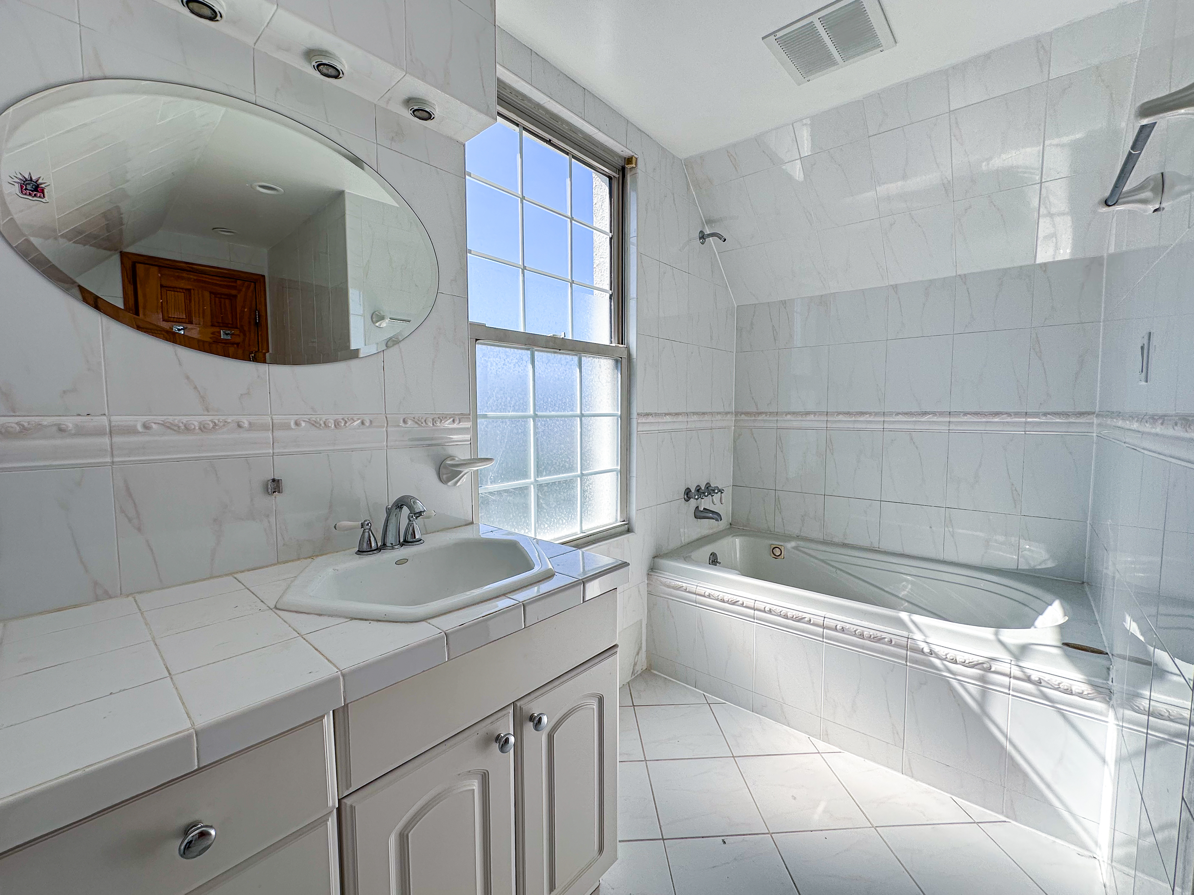 66-42 Clinton Avenue, Unit 2 Queens, NY 11378 - Photo 14 of 14 a bathroom with a sink a toilet and bathtub