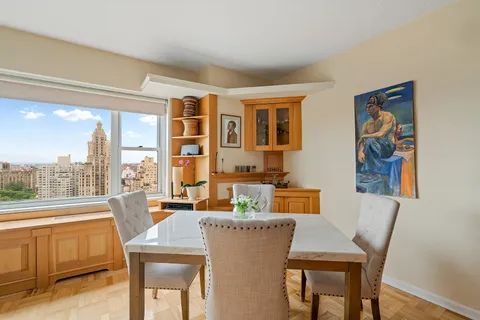 a view of a dining room with furniture window and outside view