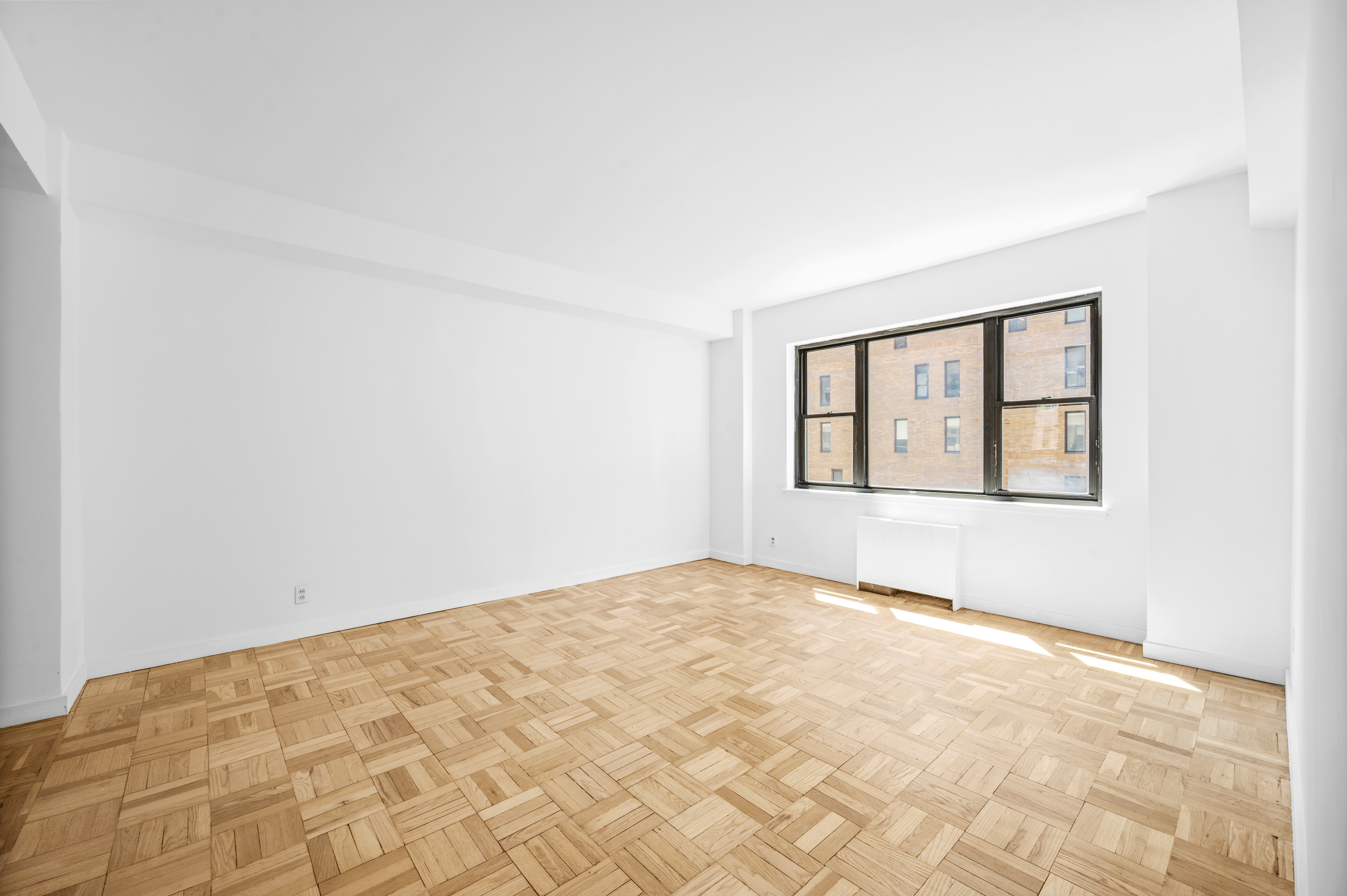 a view of an empty room with windows