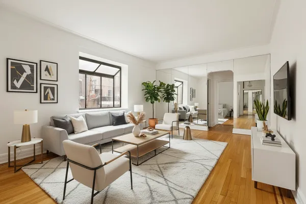 a living room with furniture large window and flat screen tv
