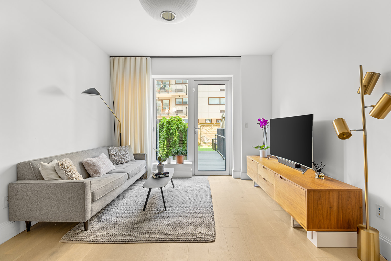 610 Warren Street, Unit GDNB Brooklyn, NY 11217 - Photo 5 of 17 a living room with furniture and a flat screen tv