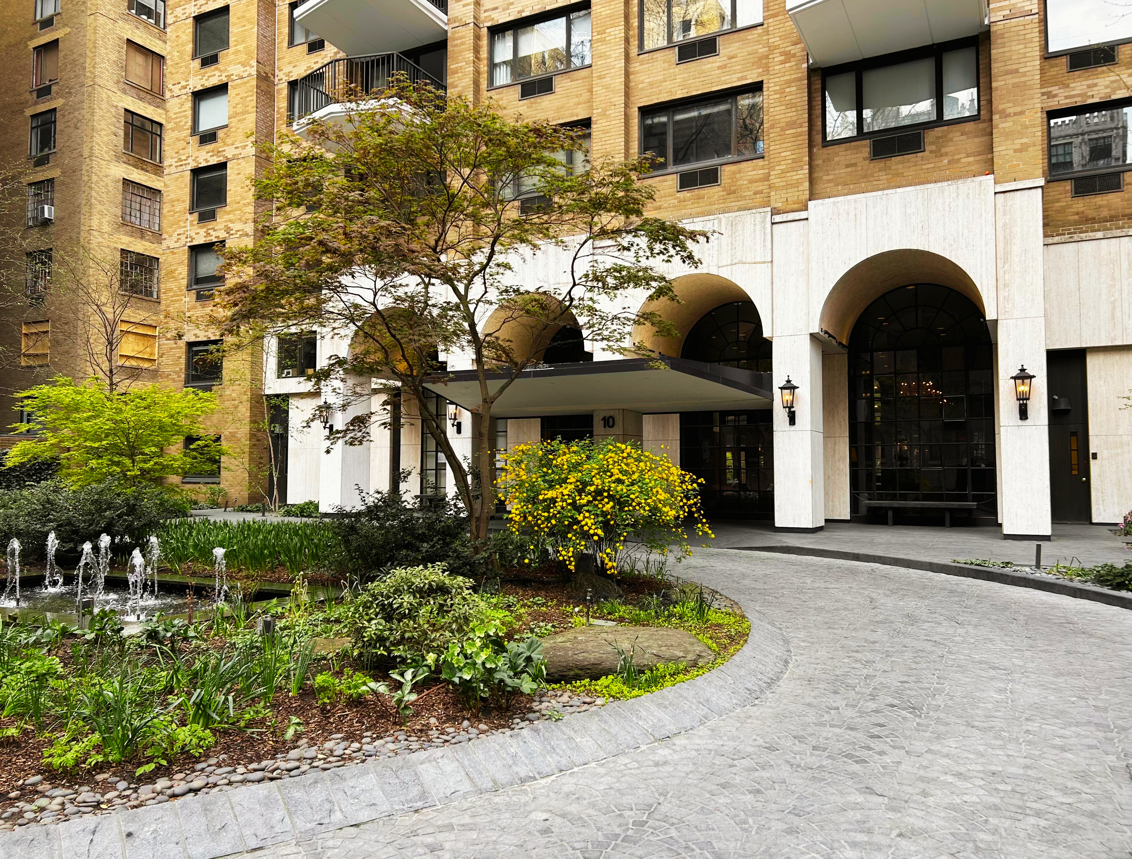 10 West 66th Street, Unit 7C Manhattan, NY 10023 - Photo 16 of 19 a front view of a house with plants