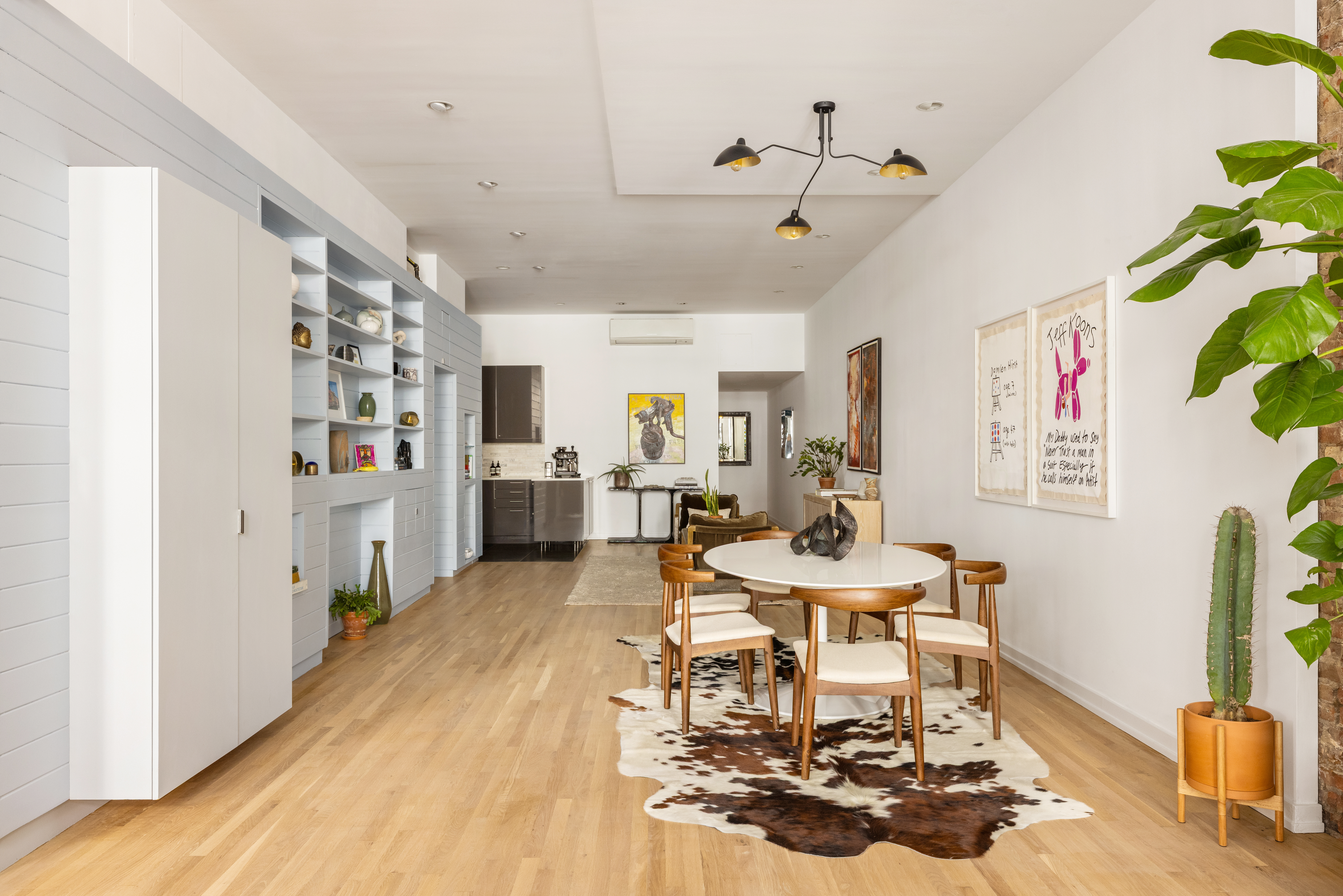 56 East 11th Street, Unit 5 Manhattan, NY 10003 - Photo 4 of 18 a living room with furniture and a wooden floor