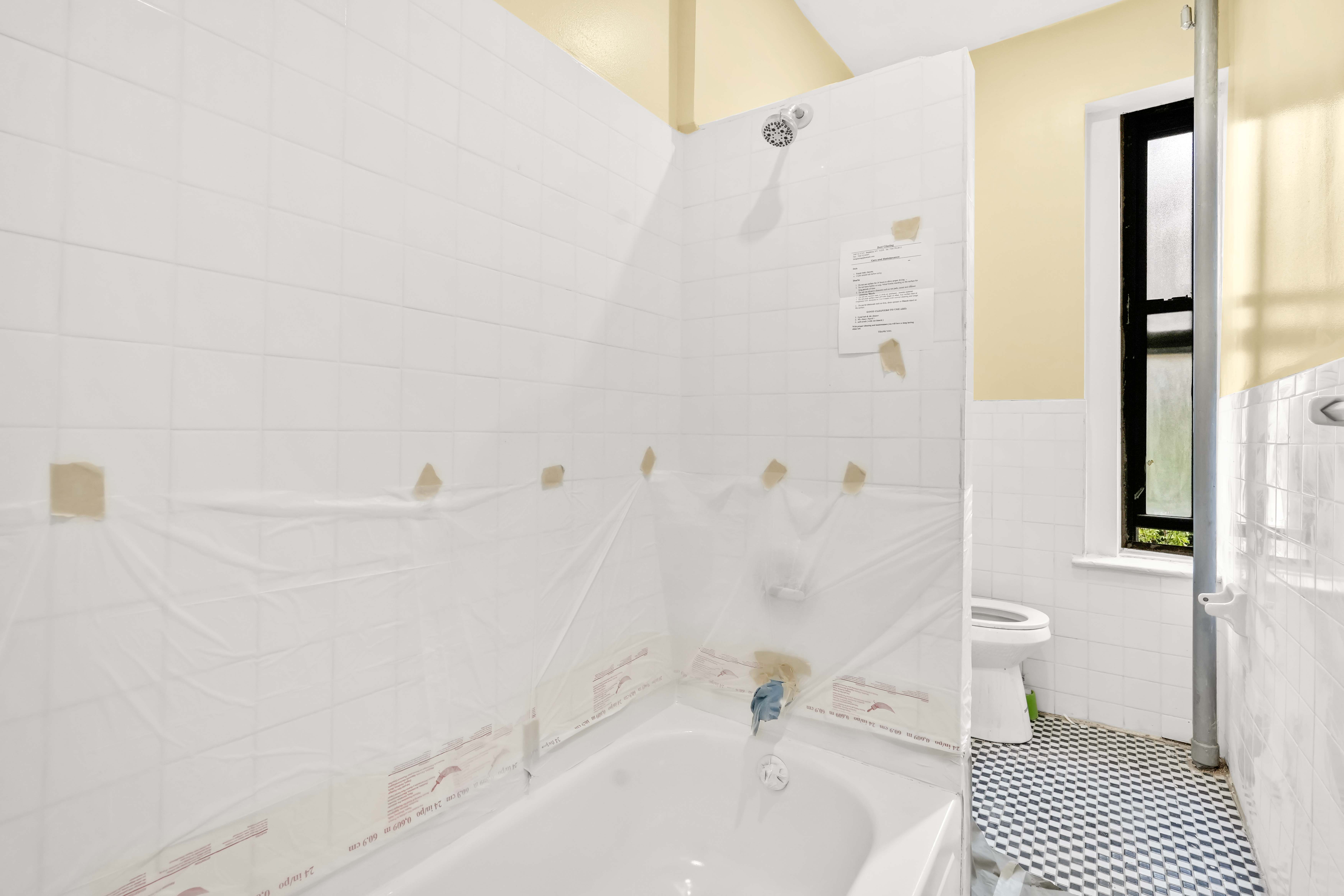 1770 Bedford Avenue Brooklyn, NY 11225 - Photo 27 of 50 a bathroom with a sink a toilet and shower