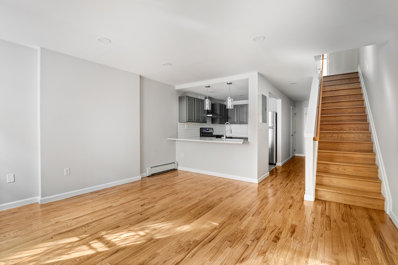 265 West 136th Street Manhattan, NY 10030 - Photo 9 of 14 a view of kitchen and wooden floor
