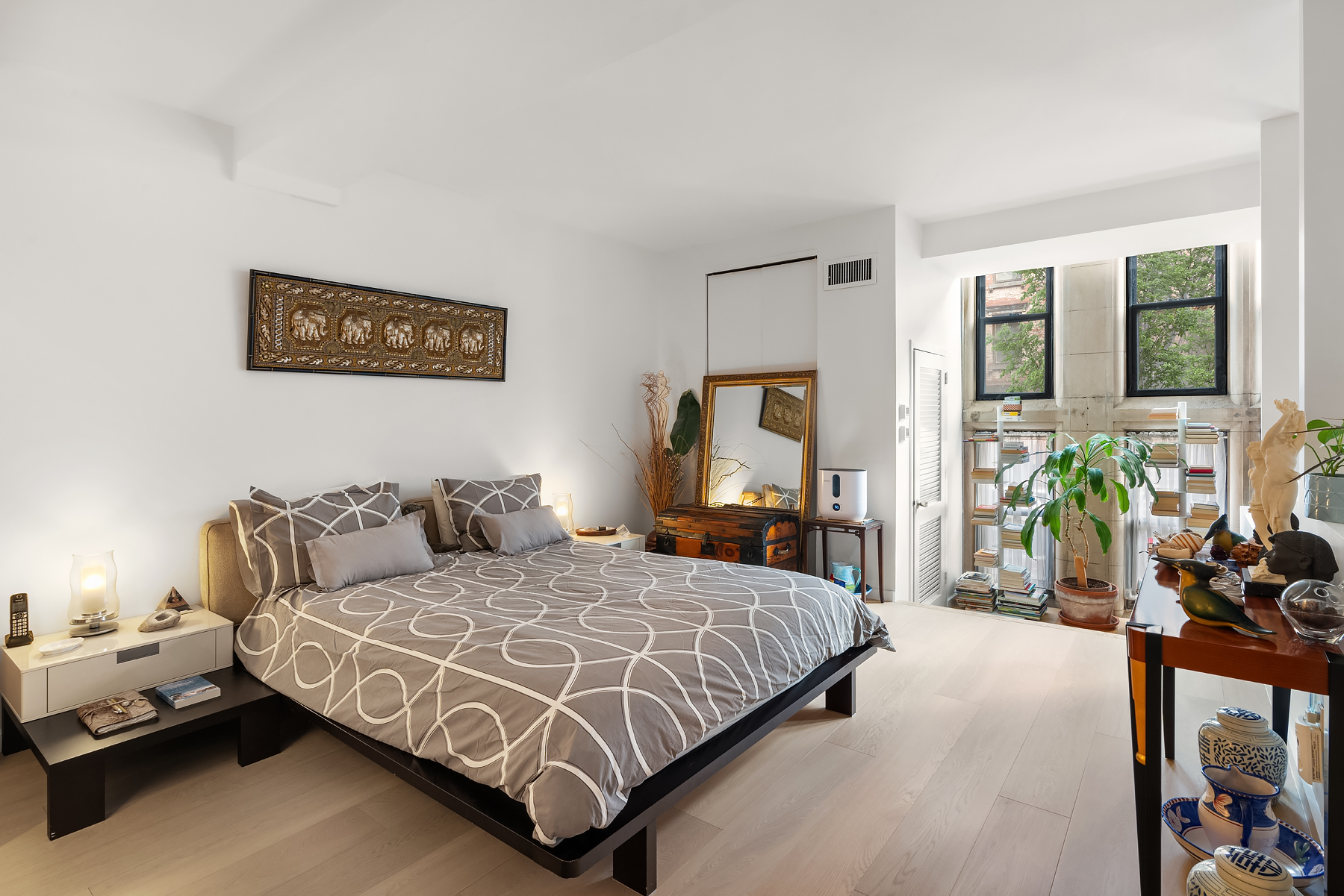 248 East 31st Street, Unit 1D Manhattan, NY 10016 - Photo 5 of 13 a bedroom with a bed window and couch