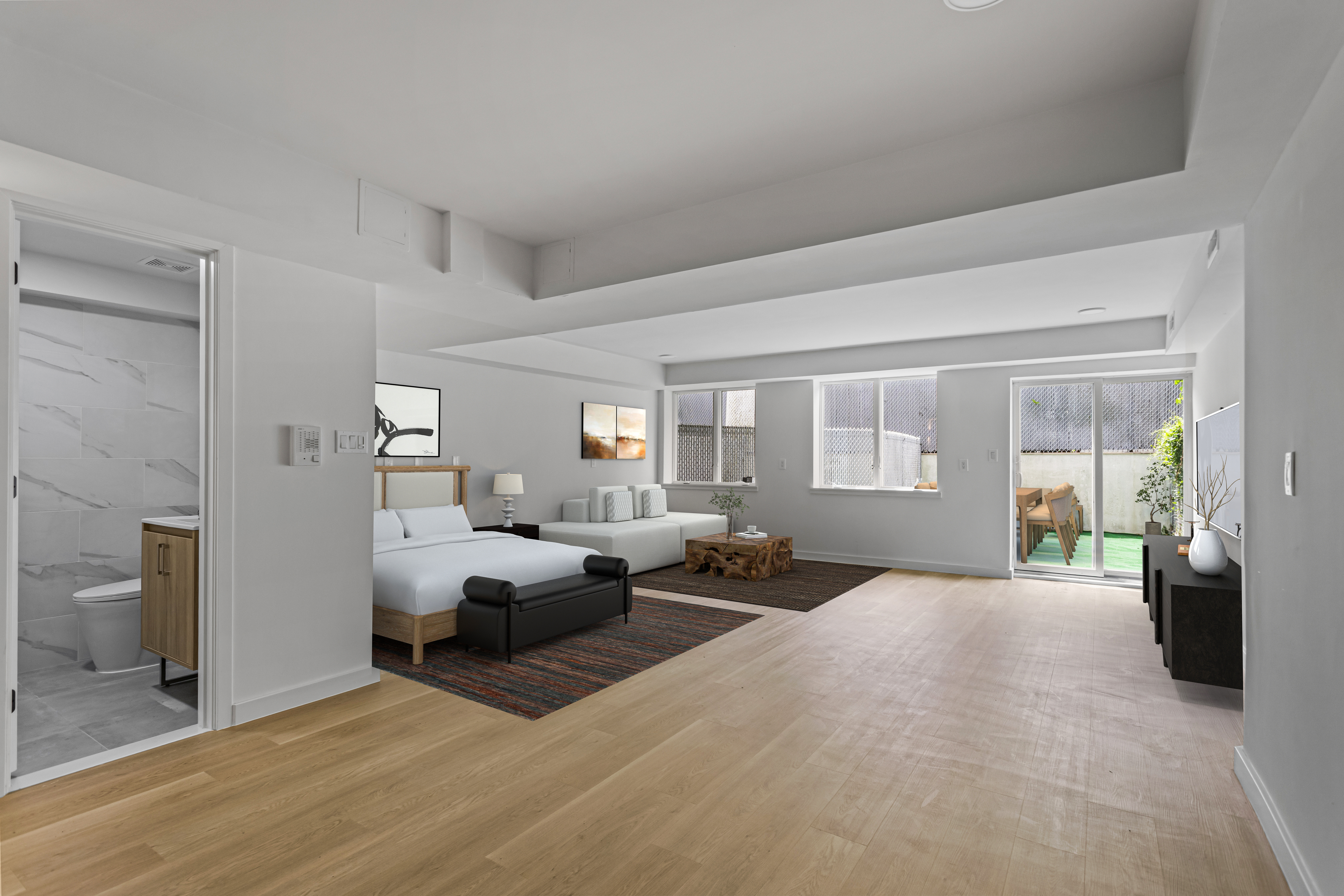 3112 Emmons Avenue, Unit 3120A-2 Brooklyn, NY 11235 - Photo 4 of 14 a large bedroom with a bed and wooden floor