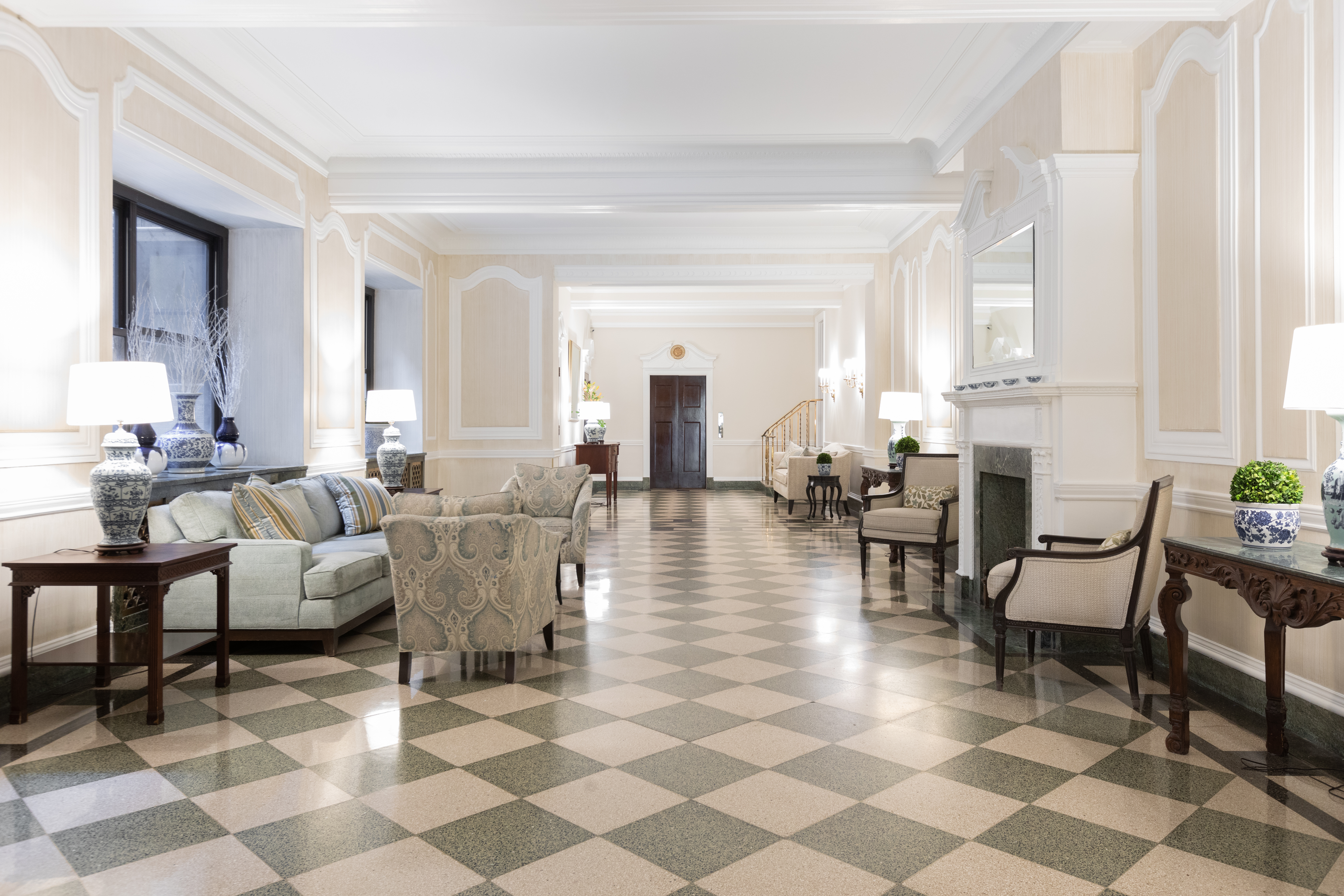1070 Park Avenue, Unit PHE Manhattan, NY 10128 - Photo 12 of 14 a living room with furniture and a fireplace