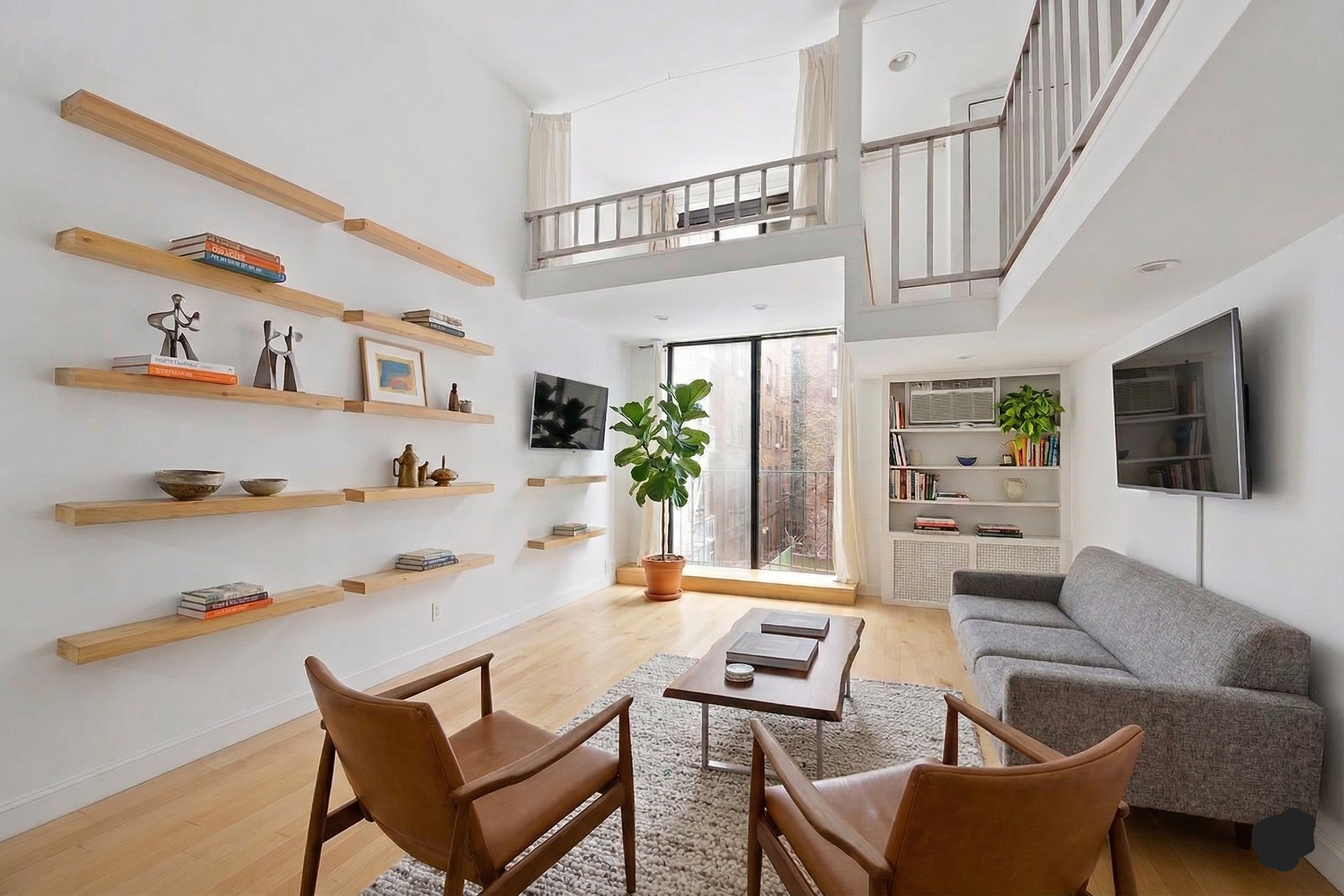 215 East 24th Street, Unit 218 Manhattan, NY 10010 - Photo 2 of 2 a living room with furniture