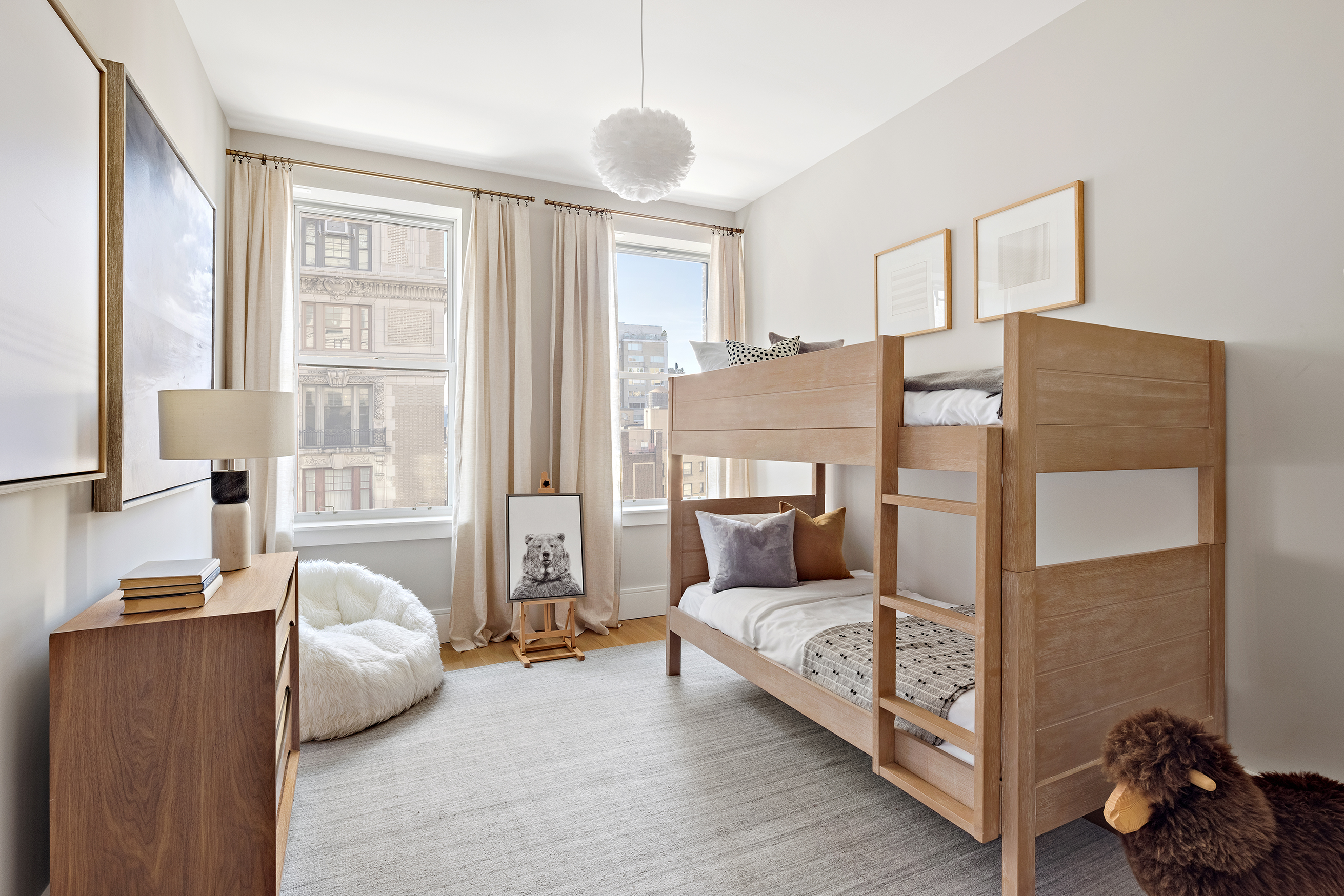 378 West End Avenue, Unit 7A Manhattan, NY 10024 - Photo 9 of 24 a living room with furniture and a large window